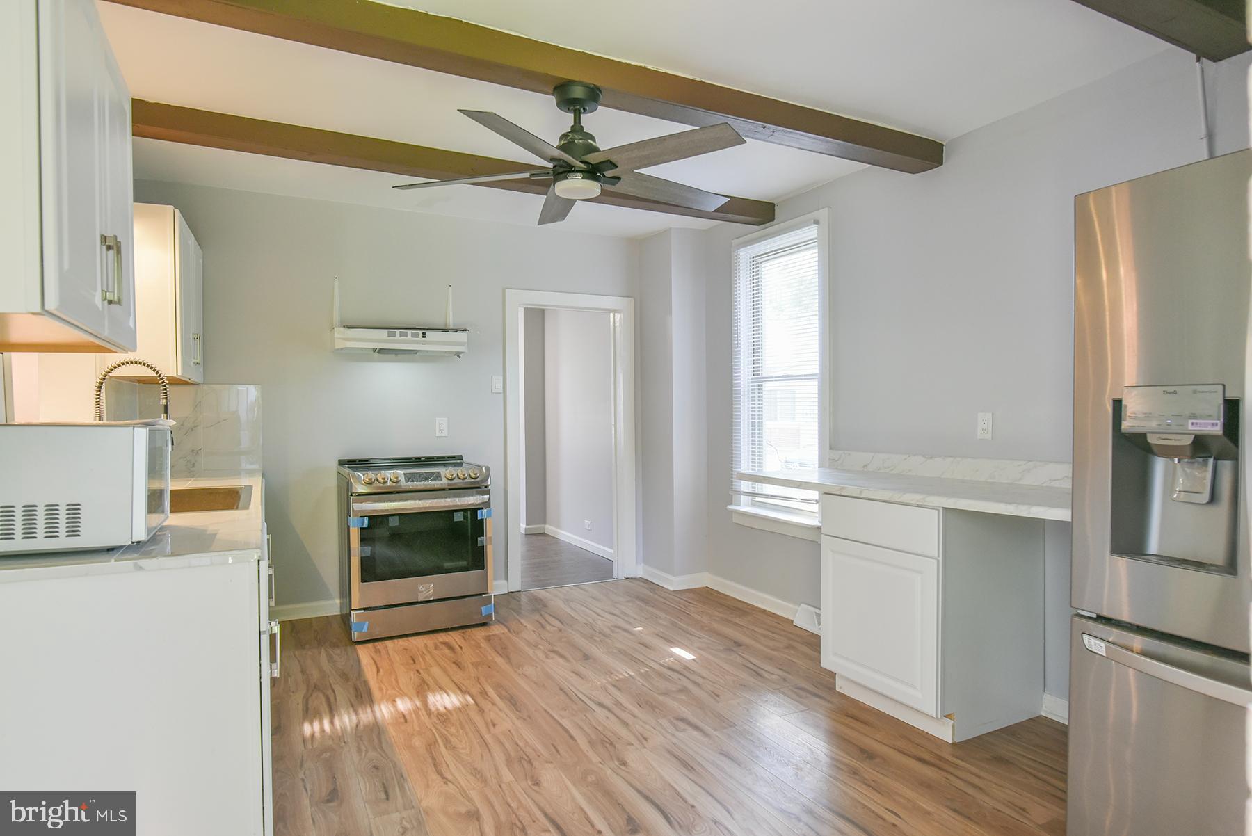 ** The City of Hagerstown is offering $7,500 to qualified buyers towards closing costs, via the Homeownership Program**  Don't miss this beautifully renovated home offering comfort, style, and space! A brand new central air conditioning and heating system has just been installed, providing year-round energy-efficient comfort. This spacious home features three finished levels, including a fully finished attic!  Step inside to find all-new flooring, fresh interior paint, updated fixtures, and a renovated full bathroom with modern finishes. The home is filled with natural light thanks to replacement windows throughout. Enjoy multiple living areas, including a welcoming family room, a formal living room, and a separate dining room ideal for entertaining. The completely updated kitchen features stylish stainless steel deep sink, stove, range hood, refrigerator. The  unfinished cellar style basement makes for good additional storage.  Outside, you'll find a massive backyard, offering endless possibilities for gardening, outdoor entertaining, or future expansion. Conveniently located near shopping, schools, and commuter routes. Don't miss your chance to own this move-in ready home with major updates already done—schedule your tour today!