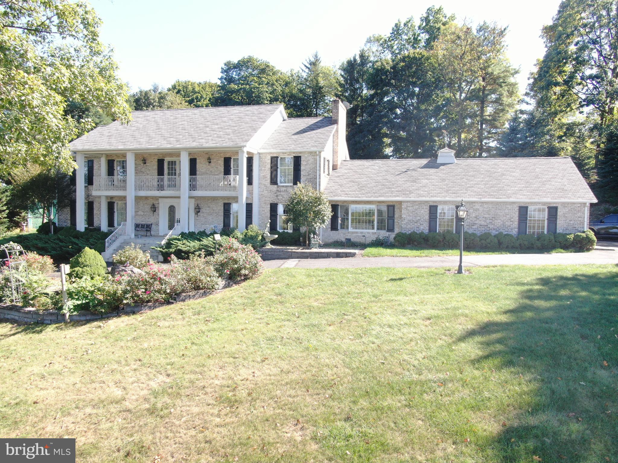 Good Bones!  Southern Colonial home with breathtaking views!  One owner home built in 1974 by the top craftsman of that era.  No expenses spared and no corners cut.  Enter the home from a large 2 car garage complete with storage closets and tool/work bench area.  Step into the family room with a cozy fireplace, bay window overlooking the mountains and newly renovated flooring.  Attached to the family room is a recently constructed sun porch.  Have coffee in the morning watching the birds and squirrels play!  The updated kitchen features granite counter tops, a large island with sit up bar along with plenty of space for a lunch/dinner table.  The formal dining room is great for holidays and entertaining, and the floor is newly renovated as well.  Move along into a huge foyer showcasing a stunning chandelier straight from the French Quarter in New Orleans!  A formal living room adjoins the foyer followed by a downstairs bedroom and bath that would make a perfect work from home office.  The 1624 square foot basement is perfect for ping pong, pool table, a movie room or dare I say man cave!  For the golfing enthusiasts, it’s perfect for a golf simulator!  The potential for hours of family time and entertainment is endless!  Upstairs, there are 3 more bedrooms featuring a massive primary bedroom and ensuite bath.  Outside is 900 square foot garage/barn.  Again, the possibilities are endless.  For the campers, a perfect place to park and store your rig from the outside elements.  For the gearheads, turn wrenches on your hot rod or favorite automobile.  Another potential spot for your man cave.  This home radiates good vibes!  Walk to the Guilford Swim Club with your family.  Don’t miss this opportunity!  Minutes from Route 30 and I-81.