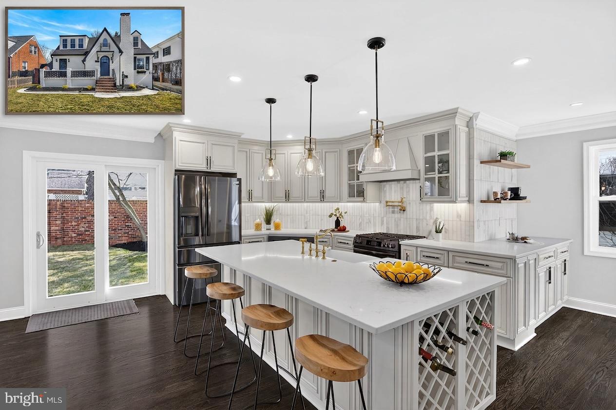 Step into this fully renovated Tudor style masterpiece in one of Arlington's most sought after neighborhoods, now priced well below comparable renovated homes in the area.
From the moment you walk in, this home feels different. The original wood-burning fireplace anchors a spacious living room that immediately feels like home, warm, elegant, and built for real life. The formal dining room sets the stage for holidays, dinner parties, and the kind of gatherings families remember.
The brand-new gourmet kitchen is simply stunning. Custom cabinetry, top of the line black stainless steel appliances, quartz countertops, brushed gold fixtures, and a large pantry come together in a space that will inspire even the most casual cook. The adjacent family room flows seamlessly from the kitchen, making everyday living and entertaining effortless.
With six bedrooms and four full bathrooms spread across three levels, there is room for everyone. The primary suite is a true retreat, featuring a walk-in closet and a spa-inspired bath with dual vanities, an oversized shower with dual rainfall heads, and a handheld spray. Two additional upper-level bedrooms share a beautifully finished custom bath. A main level bedroom doubles perfectly as a private home office.
The fully finished lower level adds exceptional flexibility,  a legal bedroom with egress windows, a large recreation area, a custom full bath, a gym or office space, and a second laundry room. Whether it's a teenager who wants their own space, an au pair suite, or a home office setup, this level delivers.
Every major system in this home is brand new, roof, HVAC, water heater, electrical, plumbing, windows, and doors. This is not a cosmetic flip. This is a complete, thoughtful renovation built to last.
Outside, the brick fenced backyard offers privacy and space to breathe. The oversized driveway provides ample parking, and the one car garage is already wired with a new sub-panel ready for EV charging.
Now let's talk location. Situated in the sought after Waverly Hills neighborhood, this home puts your family minutes from Ballston Metro, Amazon HQ2, I-66, Rosslyn, and downtown DC. Top-rated Arlington schools, parks, trails, Ballston Quarter, and Lee Heights Shops are all within easy reach. For a growing family that values both space and convenience, this is the one.
Priced at $1.499M, this is arguably the best value in Arlington right now for a fully renovated home of this size and quality. Come see it and decide for yourself.