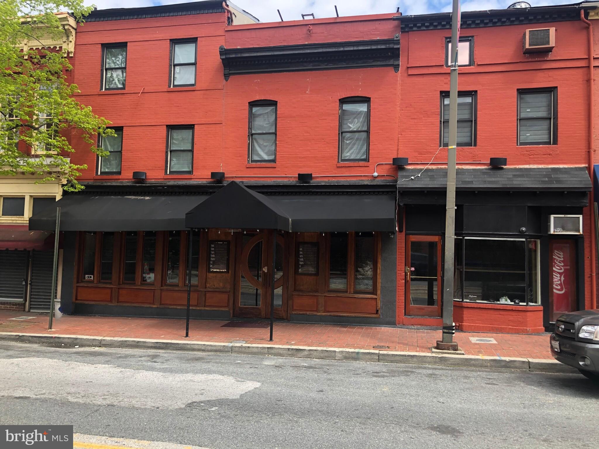 Located in the heart of Baltimore’s vibrant Midtown district, this multi-level commercial gem offers an unparalleled opportunity for restaurateurs to create a thriving dining destination. With 4 levels of usable space—including a basement and 3.5 floors—this property is designed for flexibility, featuring both a fully equipped restaurant and a connected carryout space to maximize revenue potential. Two full bars offer endless possibilities for crafting unique dining and nightlife experiences, while the exposed brick walls add warmth and character throughout. Strategically positioned across from a major hospital, the property benefits from heavy foot traffic and consistent visibility. Surrounded by bustling businesses, residential neighborhoods, and cultural landmarks, it’s easily accessible via public transportation and major city thoroughfares. Whether you're envisioning a trendy bistro, an upscale dining experience, or a lively bar and grill, 885 N Howard Street is ready to bring your vision to life.