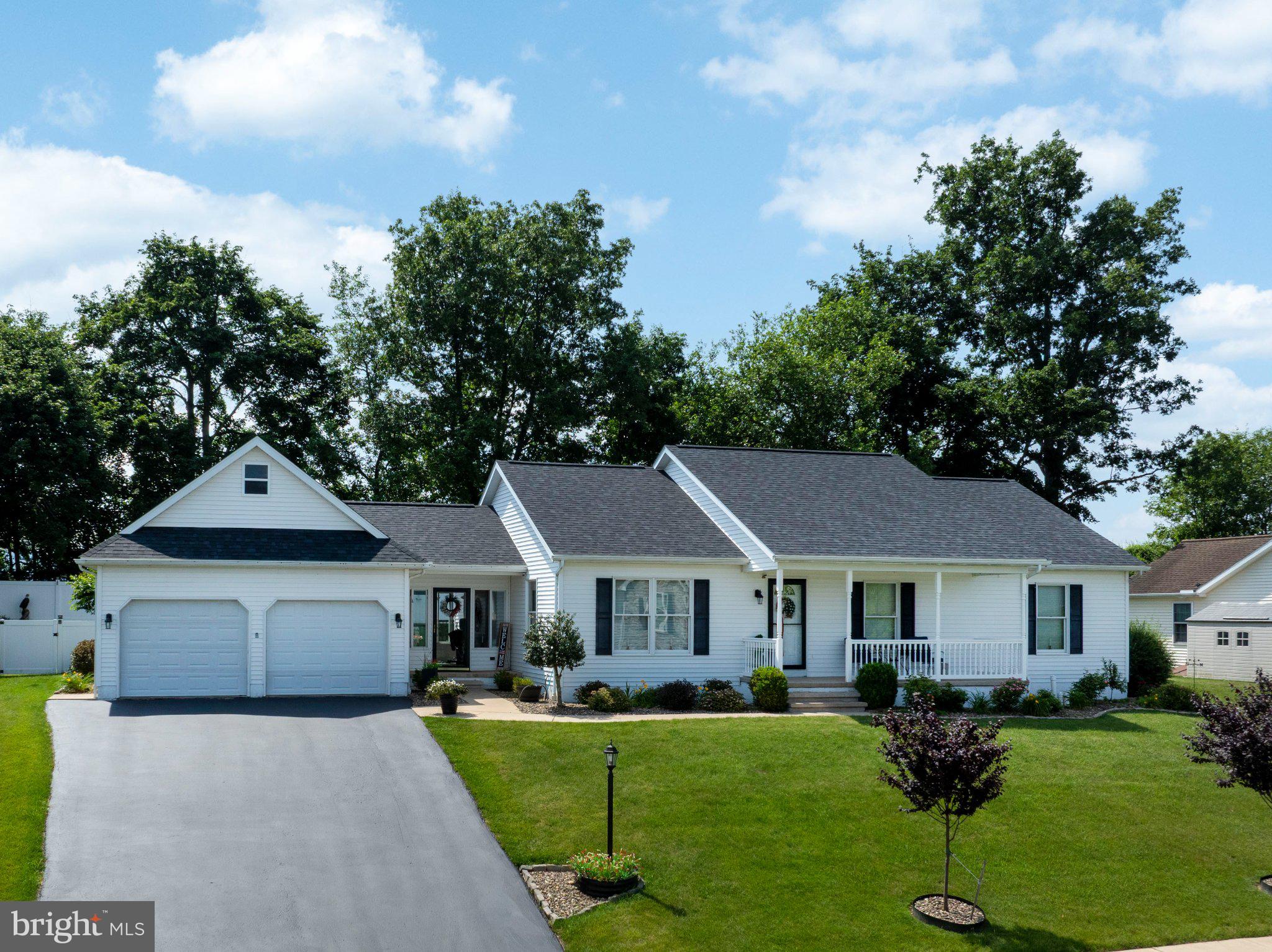 Exceptional one-floor living awaits at 126 Rosehill Drive in Burnham Farm Estates. Perched on a hill with a beautiful mountain views, this 3-bed, 2.5-bath ranch boasts big-ticket upgrades including a new roof (2025), HVAC system (2021), and newer composite deck. The welcoming front porch is a great place to enjoy the distant views and sip your morning coffee. Inside, value an open concept layout, quality hardwood floors and cozy breezeway, providing access to the oversize 2-car garage, front driveway entrance and the backyard. The living room is open, bright and spacious with vaulted ceiling and seamless transition into the kitchen and dining area. The kitchen is well-equipped and features beautiful oak cabinetry, stylish backsplash, recessed lighting and island for additional prep space or bar seating. Glass sliders lead to the expansive newer deck with private, fenced-in backyard - the perfect retreat for summer gathers or to let pets roam! A well-sized primary suite with its own private bath, two additional bedrooms and a full bath round out the main floor. A fully finished lower level consists of nice family room, rec room with wet bar and pool table (included), a half bath/laundry room combo and a storage area with workbench and utilities and walkout stairs. This one-owner home has been meticulously cared for, inside and out. Great location close to Bellefonte schools, I-99 and more! Call today for a showing!