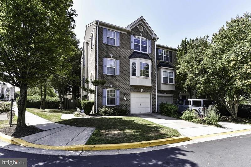 3BR, 2FB, 2HB. 3LVL,1-car garage End Unit Townhome in Silver Spring is just one mile from the ICC*Walk through main entry to lower level with tiled floors in foyer, a powder room, laundry room & French doors leading to walkout basement with decorative-only fireplace, crown molding & chair rail + recessed lighting, & sliding glass doors to backyard*Head to main upper level featuring hardwood floors, recessed lighting, crown molding, ample sunlight & neutral paint tones throughout*Open light & bright living room with bay window leads to dining room with custom built-ins*Renovated kitchen features granite countertops, complimentary mosaic tiled backsplash, stainless steel appliances + wine fridge, spacious kitchen island, pantry, eat-in dining area & sliding glass doors leading to large deck perfect for outdoor dining*Head to upper bedroom level featuring primary suite with walk in closet & full ensuite bathroom with soaking tub & dual sink vanity*Two additional, nicely sized bedrooms share second full bathroom & each have ceiling fans & hardwood floors*Home is conveniently located across the street from Aldi, CVS, Starbucks, a gym, restaurants & more*