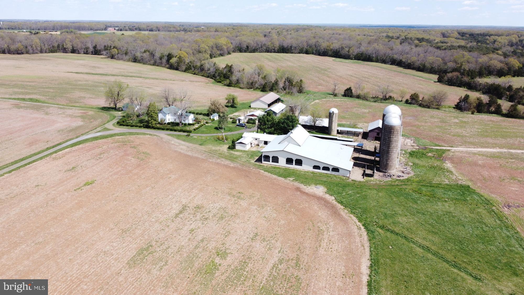 Set on ±213.5 scenic acres in Midland, this exceptional farmstead offers the ideal blend of country living and agricultural potential. The property includes a spacious fivebedroom, two-bath farmhouse totaling approximately 2,700 square feet, well-suited for full-time residence or multigenerational living. In addition, there is a separate threebedroom, one-bath home of approximately 960 square feet that offers excellent potential as a guest house, farm manager’s residence, or rental opportunity with some TLC.   

Surrounded by rolling pasture, open fields, and wooded sections, the land provides endless possibilities for livestock, hay production, crops, or expansion of a private homestead. With multiple barns, garages, and accessory buildings already in place, the property is well-positioned for continued farm operations and would make an outstanding horse farm, offering ample room for paddocks, riding areas, and trails. The peaceful, private setting delivers classic Virginia countryside charm while remaining convenient to Warrenton, Gainesville, and major commuter routes. Whether envisioned as a working farm, equestrian estate, or secluded rural retreat, this rare Fauquier County offering combines scale, versatility, and long-term potential.