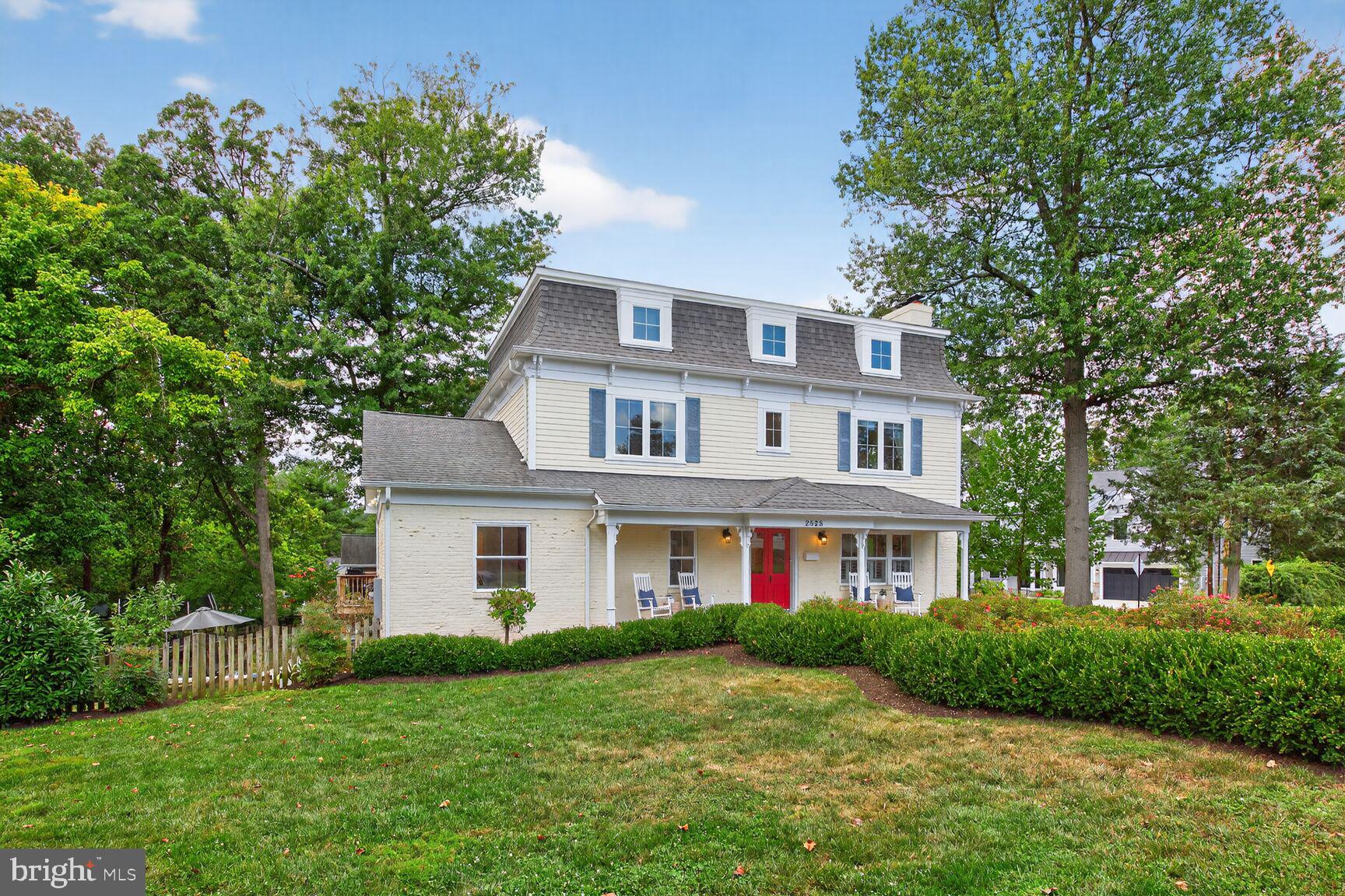 Welcome to 2828 N. Van Buren, a one-of-a-kind residence in the heart of Arlington that blends historic charm with modern design & remarkable flexibility. Rebuilt in 2017, this extraordinary property was intentionally crafted as a multigenerational home, featuring both a Main House and a fully independent Auxiliary Dwelling Unit (ADU)—a rare find in Arlington. With its own Certificate of Occupancy, the ADU operates as a true home of its own, complete with a private entrance, fully equipped kitchen, laundry, heating and cooling, and a spacious bedroom suite. Perfect for grandparents, an au pair, extended family, a dedicated home office, or an income-producing rental, the ADU makes this property as versatile as it is beautiful.

Set on a desirable corner lot, the house immediately impresses with its vintage double front doors, lovingly restored and painted a striking pomegranate red, and a winding, garden-flanked walkway that feels lifted from Alice in Wonderland. Inside, a welcoming vestibule separates the entrances to each home, offering privacy while keeping everyone connected under one roof. Nine-foot ceilings, gleaming hardwood floors, new furnace, plantation shutters, new carpet,  new LVP floors, & fresh neutral paint throughout give every room a crisp, move-in ready appeal. The Main House features a gracious, sun-drenched living room, an elegant dining room with pocket doors and statement chandeliers, and a show-stopping chef’s kitchen with shaker cabinets, granite counters, hand-painted Portuguese tile, a five-burner Italian gas range with pot filler, & a central island with seating. French doors lead from the kitchen to a sunny deck and backyard, perfect for entertaining.

Upstairs, the primary suite offers a serene retreat with hardwood floors, a walk-in closet, and a spa-like bath featuring a clawfoot tub, a walk-in shower with dual showerheads, double marble vanity, & a private water closet. Two additional bedrooms share a thoughtfully designed bath with dual vanities and a separate tub and shower room. The lower level provides even more flexible living with a bright family room, a bedroom/office with built-ins, a bonus room ideal for a gym or guest space, a large laundry room, & two massive storage rooms—ready to be customized to your needs.

The Auxiliary Dwelling Unit is equally impressive, with its own welcoming foyer, living room with gas fireplace, French doors to a private deck, and a stylish kitchen w/ shaker cabinetry, quartz counters, modern lighting, & a striking tile backsplash behind the gas range. The bedroom suite includes a walk-in closet and a spa-inspired bath with imported tile, glass-enclosed shower, & marble vanity. A second room w/ custom built-ins and pocket doors offers the perfect office, guest space, or reading nook, & a private laundry area completes this independent home.

Outside, the landscaped yard bursts w/ charm, from hydrangeas and tiger lilies to apple trees and flowering shade trees. A fenced backyard w/ patio space provides both beauty and function, while the front porch—w/ its ceiling fans and timeless character—is the perfect place to enjoy morning coffee or evening wine. The one-car garage and long driveway provide plenty of parking.

Beyond the property itself, the location is unbeatable. Nestled at the intersection of two quiet, tree-lined streets, this home is within walking distance of Tuckahoe Elementary, neighborhood parks, and the East Falls Church Metro, offering quick access to DC, Tysons, & Dulles. Farmers markets, highly rated restaurants, shops, and libraries are minutes away, making everyday life convenient & enjoyable.

Featured in Arlington Magazine, Viva Tysons, and Home & Design for its unique design and thoughtful functionality, this home is as special as it is rare. If you’ve been searching for a property that combines timeless character, modern upgrades, & true flexibility for multigenerational living or rental potential, 2828 N. Van Buren is it!
