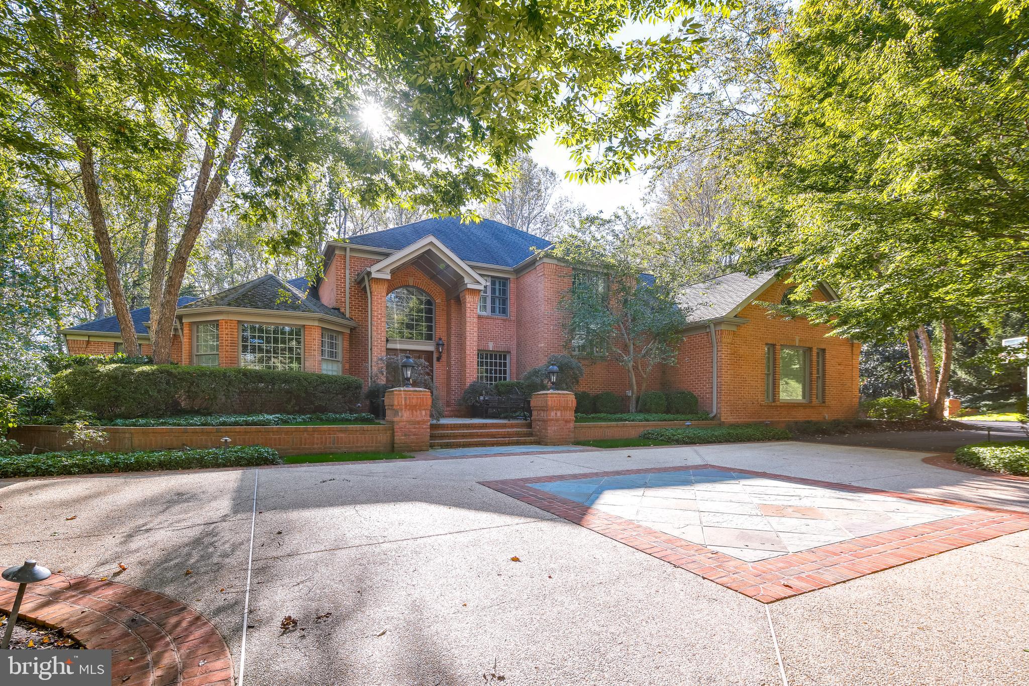 Rarely does one have the opportunity to secure a custom property like this - sited on a very private 1.69 acre lot adjacent to state parkland. Total finished area in this home is over 9000 square feet with classic architectural features on display at every turn. This level of craftmanship and millwork is seldom found. The owners spared no time or expense to create a design masterpiece.  The home features coffered ceilings throughout, inlayed woodwork, complimenting crown moldings, chair rails, and classic oversized baseboards.  Soaring ceilings accent the timeless built-ins that are featured on all levels and especially shine in the main floor grand family room and in the lower level great room.  The main level great room flows easily through light-filled sliding doors to the custom redwood deck and patio. 
This home boasts two full gourmet kitchens with custom cabinetry and stunning layouts. High end appliances are found in both kitchens along with built-in wall ovens and gourmet gas ranges. Spectacular lighting packages are a highlight of the home and add that special feel to every room. Stunning hardwood floors are featured on all levels with an especially rich style and quality on the lower level.  Expansive bedrooms on each level boast large light-filled windows with unique design elements which need to be seen to be appreciated. Every season of the year will bring unique and glorious views to the indoors.  Additionally featured is a children's imagination room that will melt your heart. This unique area with age-appropriate access rarely grants adults the privilege of entering. Older folk need to be on their best behavior to be invited in! The owner has lovingly created a spectacular art room which opens to a private stone patio. This special space will take you away from the cares of the world and invite you to explore your creative side.
The secluded and tranquil grounds feature extensive landscaping and spectacular hardscaping elements that feature custom stonework and architecturally designed elevations. A summer favorite will be the large pool with spa and waterfall feature. This special area which ties seamlessly to the lower-level kitchen and great room will be host to many grand gatherings of family and friends.  Outdoor living in this stunning oasis will be enjoyed for many years.