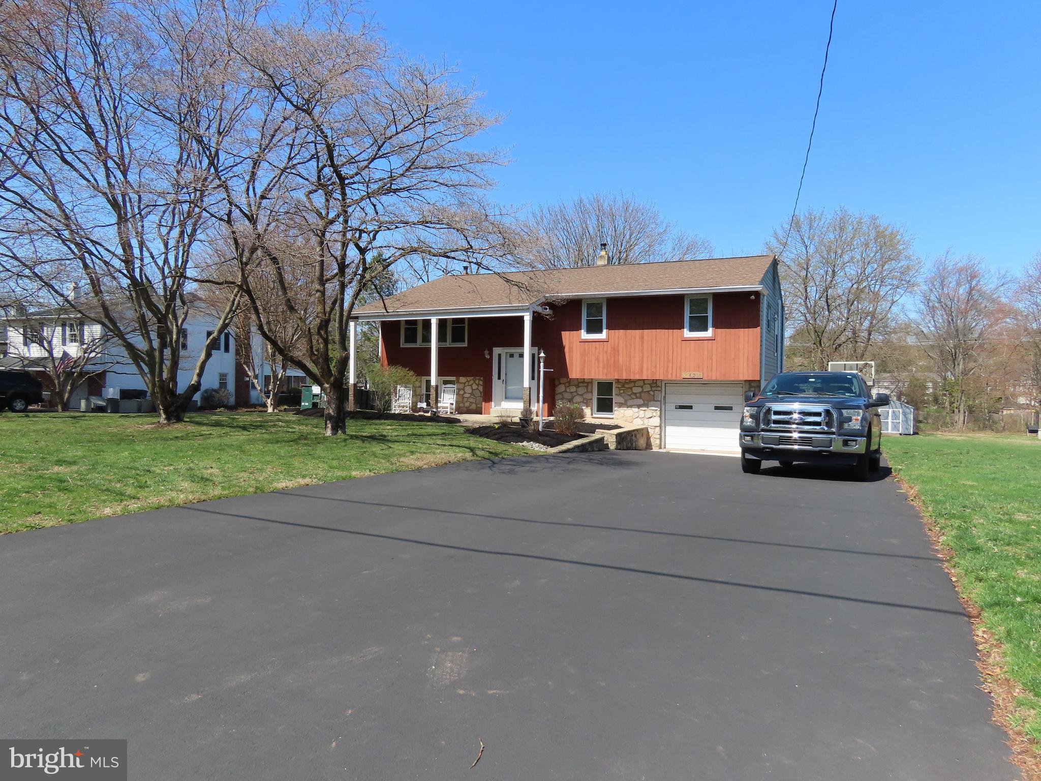 Updated and very well maintained home on almost half an acre in the award winning Council Rock School district! The first floor was completely remodeled to create an open floor plan with lots of natural light and the kitchen is spacious and modern. There are 3 bedrooms and 2 updated bathrooms on the first floor. The Central Air, Hot water heater and gutters are all new and the newer driveway is huge and can hold 6 cars. The lower level is also open and features a beautiful stone fireplace a half bath and an office/ game room.  A large yard in the back is great for BBQ's or entertaining. This is a lovely home and a great area, see this one ASAP before it is gone.