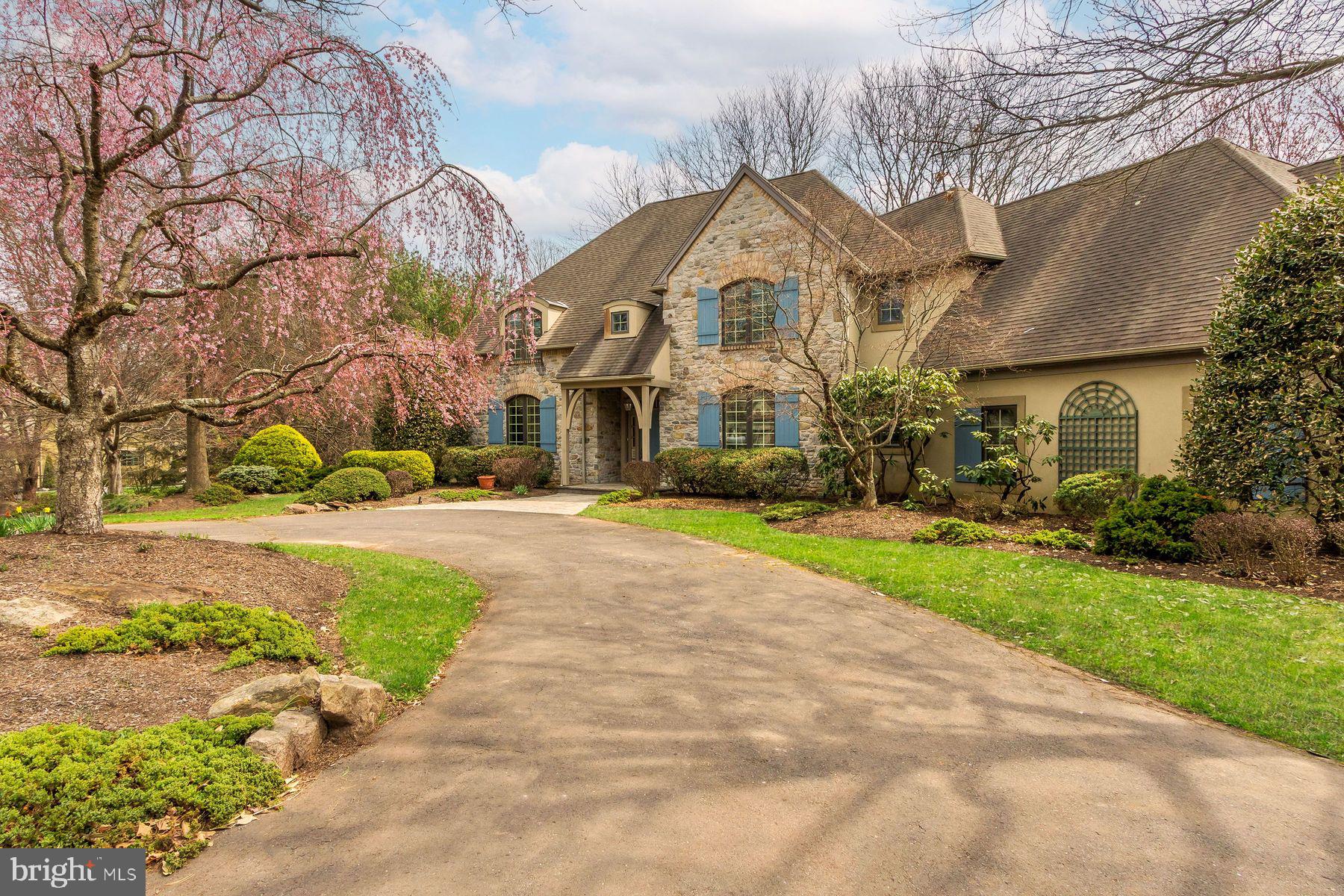 Custom Stone Manor by Zaveta | A Rare Opportunity to Reimagine. Tucked within a small enclave of distinguished homes and set at the end of a quiet cul-de-sac, this custom-built stone manor by Zaveta offers timeless architecture, privacy, and exceptional potential. Designed with both scale and livability in mind, the home features a first-floor primary suite with a tray ceiling, complemented by gracious living spaces throughout. The living room with fireplace, skylights, and French doors opens to a peaceful yard, filling the home with natural light and a seamless indoor-outdoor connection. A formal dining room, library with custom built-in bookcases, and a bright kitchen overlooking the gardens provide a classic yet highly functional layout. A first-floor laundry room adds everyday convenience. Upstairs, three additional bedrooms, two full baths, and a lofted family room create flexible living space, while a cedar closet offers thoughtful storage. Additional areas present the opportunity to customize for a gym, wine cellar, craft or creative studio. Set on a beautiful, private lot surrounded by preserved land, the property enjoys a rare sense of tranquility and natural beauty. A three-car garage and separate garden shed complete the offering. This home is in need of renovation, but offers exceptional bones, scale, and craftsmanship—a rare chance to update and elevate a Zaveta-built residence to its next chapter.