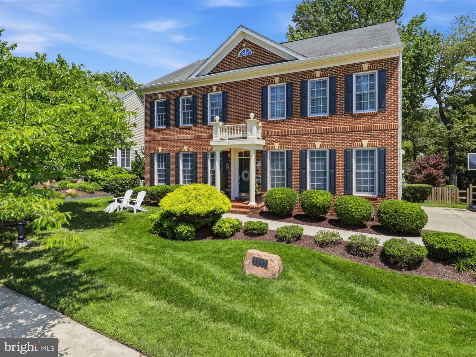 A classic brick front colonial, 3717 Taft Ave delivers nearly 5,000 square feet of finished living across four levels. This home doesn't just have room, it has the right rooms, in the right condition, and outdoor space that's genuinely hard to find. All within the Douglas MacArthur Elementary School district in the City of Alexandria.

This home breathes refined serenity with a cozy vibe. The main level flows easily between formal and casual. A light-filled front living room framed by shutters and wainscoting opens to a separate formal dining room, while the back of the house lives the way you actually want: an open kitchen, breakfast area, and family room anchored by a stone gas fireplace and custom built-ins. The kitchen with granite counters, stainless appliances, gas range, tile backsplash, and a center island, sits at the heart of it all, with clean sight-lines through to the formal entertaining area as well as the family room and out to the patio and yard beyond.

Upstairs, the primary suite is a true retreat with real depth, tray ceiling, private sitting area, two walk-in closets, and a spa-style bath featuring a soaking tub, separate shower, and dual vanities. Three additional bedrooms, two more full baths, gorgeous wood floors, and bedroom-level laundry further anchor the property as a true home of distinction.

A finished fourth-level loft adds a fifth bedroom or flexible suite that might be ideal as a home office, studio, guest room, or private space.

The walkout lower level is built for how people truly unwind and live in a home. A dedicated home theater room with tiered seating and projection set up, a wet bar, large rec room with gas fireplace, and a full bath. It's a whole second world for movie nights, game days, play dates, full house gatherings, and guests.

Then there's the outdoor space. An expansive stone patio with a fire pit and multiple seating zones steps down to a level, fully fenced grass yard with room to play, room to entertain, and that backs directly to Fort Williams Park. The back yard lighting makes this a true owner’s paradise tucked into the heart of the city.

Five bedrooms, four and a half baths, four finished levels, a two-car garage, and a fenced yard backing to Fort Williams Park, zoned for Douglas MacArthur Elementary. 3717 Taft Ave is move in ready for the household that wants everyone to have their own space and still come together in one.