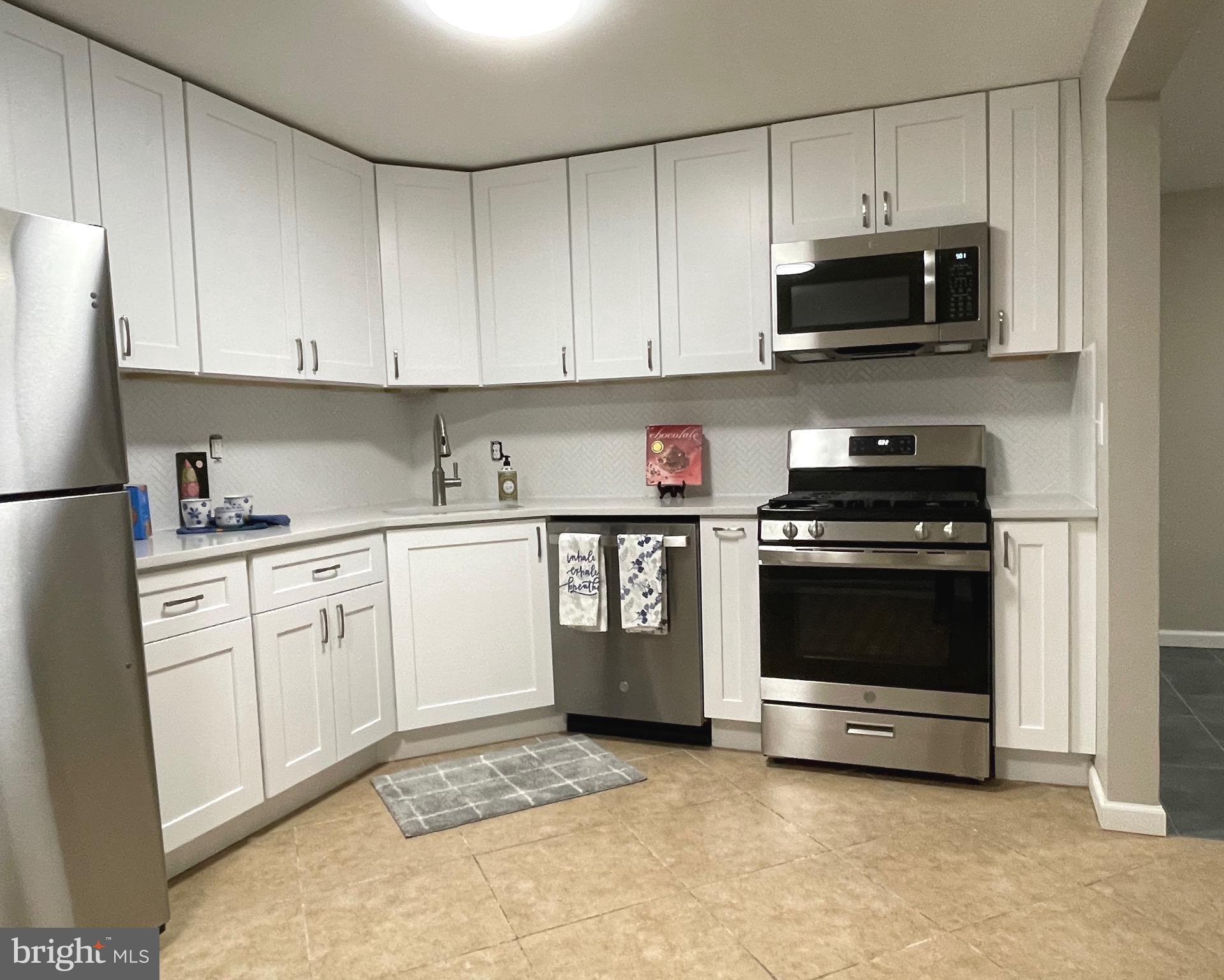 Huge 883 sq ft one bedroom  — Just renovated . . . SO you don’t have to !!!  Brand New white shaker style Kitchen cabinets With Quartz counters in kitchen and bath. - Tiled kitchen floors
new engineered wood flooring  In living room and bedroom -Sun filled living room  exits to your private outdoor space . Huntley Square community offers  welcoming outdoor pool, extensive common areas and plenty of parking right out front.
Adjacent popular  Rosecroft Shopping Center  - that’s convenient- and distance is  Less than 5 miles to National  Harbor!  Easy access to jump on 495 And head towards Virginia or In DC