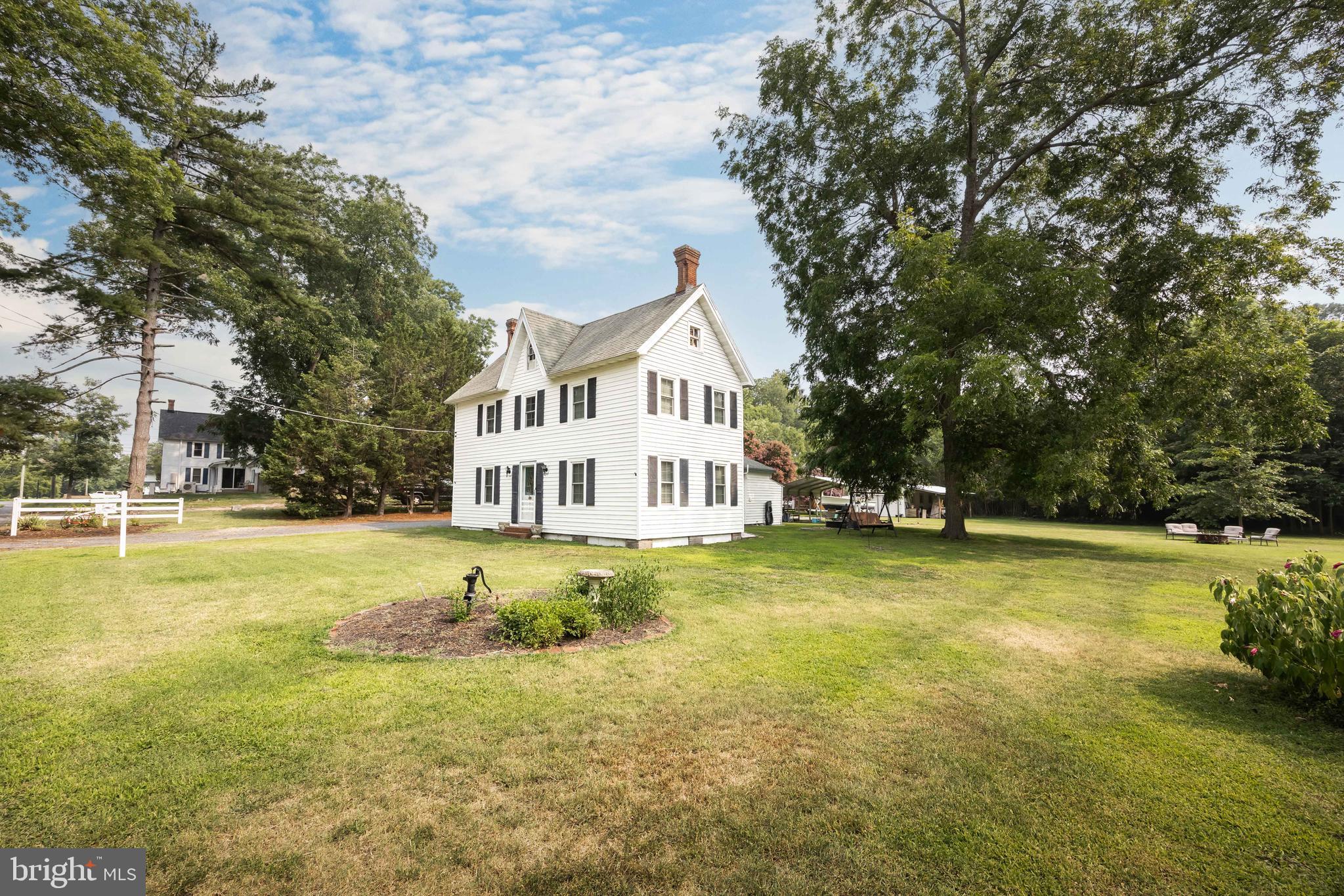 Welcome to this charming Eastern Shore home nestled on over an acre with beautiful views of the Nanticoke River! Built in 1890, this 3-bedroom, 1.5-bath home offers 1,616 square feet of comfortable living space while maintaining its warm character and charm.

A covered side entrance welcomes you into the spacious eat-in kitchen, the heart of the home. Just beyond the kitchen is a versatile bonus room with backyard access, conveniently connected to the laundry area featuring a utility sink and half bath. Toward the front of the home, you'll find a generous living room highlighted by a cozy pellet stove, knotty pine ceilings with exposed beams, and a beautiful knotty pine accent wall, creating the perfect space to relax or gather with family and friends.

The first-floor bedroom offers convenient main-level living and adjoins the full bath, which is also accessible from the hallway. Upstairs are two additional bedrooms along with a landing that provides extra storage with its own closet.

The home is equipped with mini-split systems providing efficient heating and cooling on the main level, while the upstairs features electric baseboard heat and window air conditioning units.

Outside, you'll appreciate the 12' x 24' detached garage, plus a carport that has been transformed into a wonderful outdoor entertaining space complete with two mounted ceiling fans—perfect for summer cookouts or relaxing evenings.

Enjoy peaceful river views and exclusive private community access to the Nanticoke River available to residents of Quarter Landing Lane. The nearby Nanticoke Harbor offers a sandy beach, with Cedar Hill Marina, additional public beaches, and several public wharfs just minutes away. Whether you enjoy boating, fishing, crabbing, kayaking, or simply taking in the beauty of the Eastern Shore, this location offers endless opportunities to enjoy life on the water.

If you've been searching for a quiet country setting with water access, river views, and plenty of room to spread out, this charming property is ready to welcome you home.