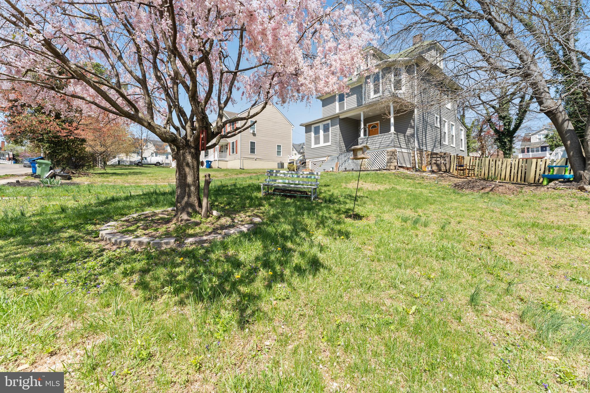 Welcome to 4004 Fleetwood Avenue — a spacious and versatile home in the heart of Baltimore, thoughtfully designed with room to grow and spaces that adapt to your lifestyle!  Step up to the inviting covered front porch with newly installed outdoor carpet, and into a bright foyer that leads into a large living room with a convenient half bath, complete with a new vanity and fresh paint — perfect for both everyday living and guests.  Flow into the open dining and kitchen area, where the kitchen boasts brand-new flooring and overlooks the dining space. A rear door leads to the flat backyard, ideal for outdoor entertaining and everyday convenience. Outside, you'll also find a bonus one-car garage and a backyard shed — perfect for storage or workshop space.  The unfinished basement offers excellent storage and houses the home’s major systems, including a new sump pump installed in 2024.  Upstairs, you'll find a full hall bathroom, a primary suite with its own private full bath, and two additional bedrooms — one of which includes a walk-through to the finished third level. The top floor is currently used as a fourth bedroom and features a mini split system and its own full bath, making it a great option for guests, a private retreat, or flex space.  Recent updates in 2023 include new laminate flooring on the first floor, new carpet throughout the entire home, new siding around the entire exterior, and roof repairs.  Additional updates include a new sump pump (2024), new kitchen flooring, new vanity in half bath, new outdoor carpet on the front porch, and fresh paint throughout (2025).  The long driveway offers off-street parking for 6+ vehicles, a rare city bonus!  This home offers space, functionality, and updates already in place — schedule your private tour today!