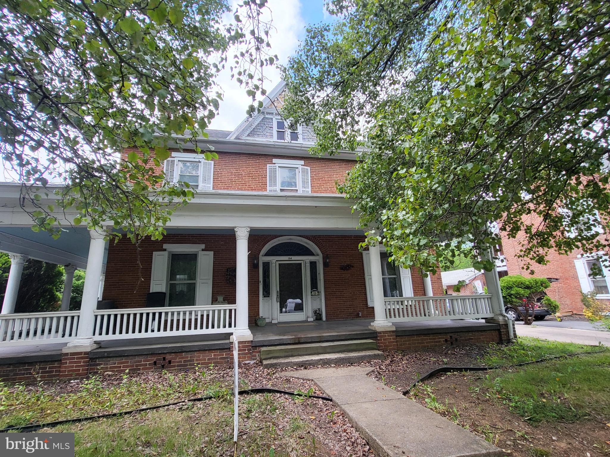 "EARLY VICTORIAN IN MERCERSBURG"  You will love the huge wrap around front porch for evening enjoyment!    5 bedrooms & over 3,000 square feet.  2 baths, 1 with ball & claw foot tub & walk in shower.  2 kitchens, 2 fireplaces.  Situated nicely on quiet street near Mercersburg Academy.  2- 2 car detached garages on sizeable lot.  Borough utilities.  This house was the beauty of the neighborhood,  lovely woodwork throughout.  Can be brought back to its grandeur for future generations.  Great opportunity for a flip or buy your future home at a repair discount.   Owner transferring
