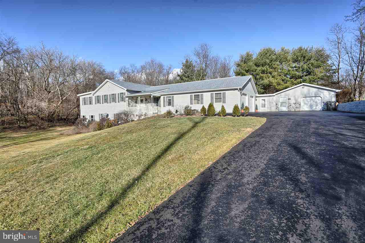 Home features 4 bdrs and 2.5 bths. All bedrooms have roomy closets. There is a large eat in kitchen w/ access to the spacious sun room and two car attached garage. There is a beautiful carpeted living room w/ lots of natural light, a large family room w/ access to the back patio, and a spacious game room great for entertaining w/ half bath, bar, gas fire place and access to the integral 2 car garage. Home has lots of windows, offering and abundance of natural light. Also, there is a detached 1 car garage.