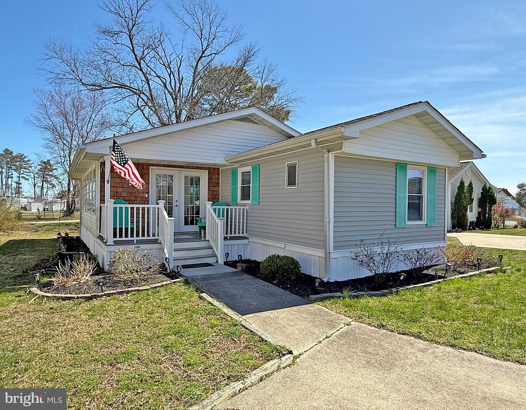 Rehoboth Bay Community has boat slips for rent, a community boat ramp, a boat storage area, a bayfront pool, a crabbing/fishing pier, a small sandy beach near the pool, tennis/pickleball courts & more!  And it is just 6.5 miles to the famous Rehoboth boardwalk. This 14’x70’ 1983 Commodore was taken down to the studs and fully remodeled in 2022, including all new plumbing and electric wiring. Drywall, luxury vinyl plank flooring, granite countertops in the kitchen, remodeled baths & so much more! The open floor plan has the living room adjoining eat-in kitchen. The kitchen has a beautiful granite breakfast bar that accents the bright, white cabinetry and the stainless steel appliances. The kitchen has a large walk-in utility closet that serves as a pantry and the laundry room. The laundry has a newer full-size Maytag washer and dryer set. Split bedroom plan. The main bedroom is at the rear of the house. It is en Suite and has a walk-in closet. That bath has an elegant sink vanity and a walk-in shower. The other two bedrooms are both generously sized, and they share the second full bath, which has a tub shower. You are going to love the 12’x24’ enclosed porch. It features jalousie windows, so you can enjoy the cool breezes off of the bay. There is also a covered, front porch with cedar shake accents. That porch has a set of pull-down stairs to a little attic storage space, too. If you have your boat or PWC in the community's storage yard, you can walk right down the lane out your back door to access the boat ramp. Golf carts are permitted.  The community allows 2 pets (no fences, though). No short-term rentals, but rental of 6 months or longer are allowed.  Leasehold Interest: Lot Rent of approx. $721.85/mt. includes water service & trash/recycle. (Delaware law caps rent increases as per 25 Del. C. Sec 7050-7054 with Lease renewals on Jan. 1). Homeowner pays electric, sewer, LP gas, cable/Internet, and lawn maintenance.  Hometown America, the community owner, requires an Application from the Buyer (and all adult occupants 18-year-of-age or older), with acceptance based on the following criteria: 1.)income verification, 2.)credit bureau score, plus evaluation of debt-to-income ratio, and 3.)criminal background check.  .Financing may be available to qualified borrowers from only a very few Lenders who specialize in installment/chattel loans for manufactured homes on leased land. Closing costs will include a real estate transfer tax (3.75% DMV Doc Fee) & a Settlement Agent fee.