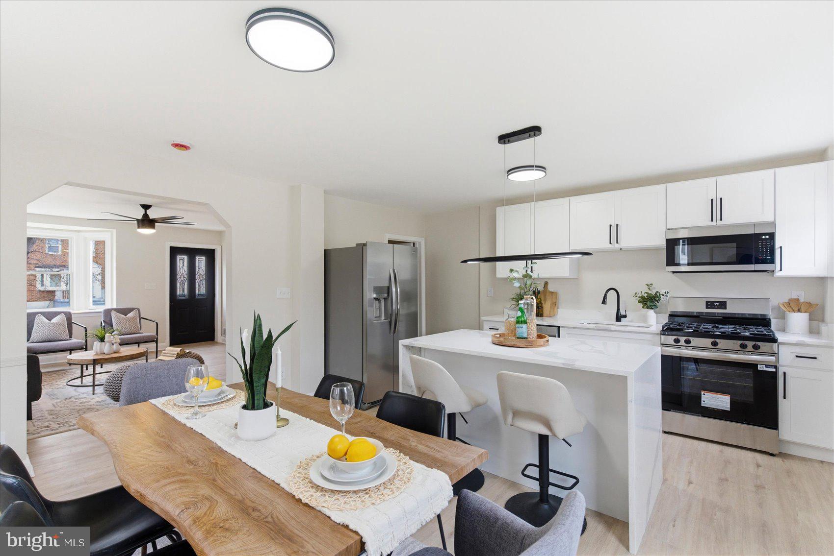 MOTIVATED SELLER!! Beautifully renovated 4-bedroom, 2 full bath end-of-group rowhome in desirable North Bend! This light-filled home features an abundance of natural sunlight, highlighted by two stunning bay windows — one in the living room and one in the dining room — creating bright and welcoming spaces throughout.

The updated kitchen is designed for both style and functionality, offering quartz countertops, a spacious island, stainless steel appliances, and gas cooking. Step right out to the deck off the kitchen — perfect for entertaining or enjoying outdoor dining.

Upstairs, you’ll find three comfortable bedrooms with plush carpeting and a fully renovated bath featuring modern finishes.

The finished lower level provides a versatile fourth bedroom along with additional finished space ideal for a home gym, office, or recreation area.

Relax on the charming front porch — the perfect spot for morning coffee or evening cocktails. With thoughtful updates, generous living space, and incredible natural light, this home is truly move-in ready!