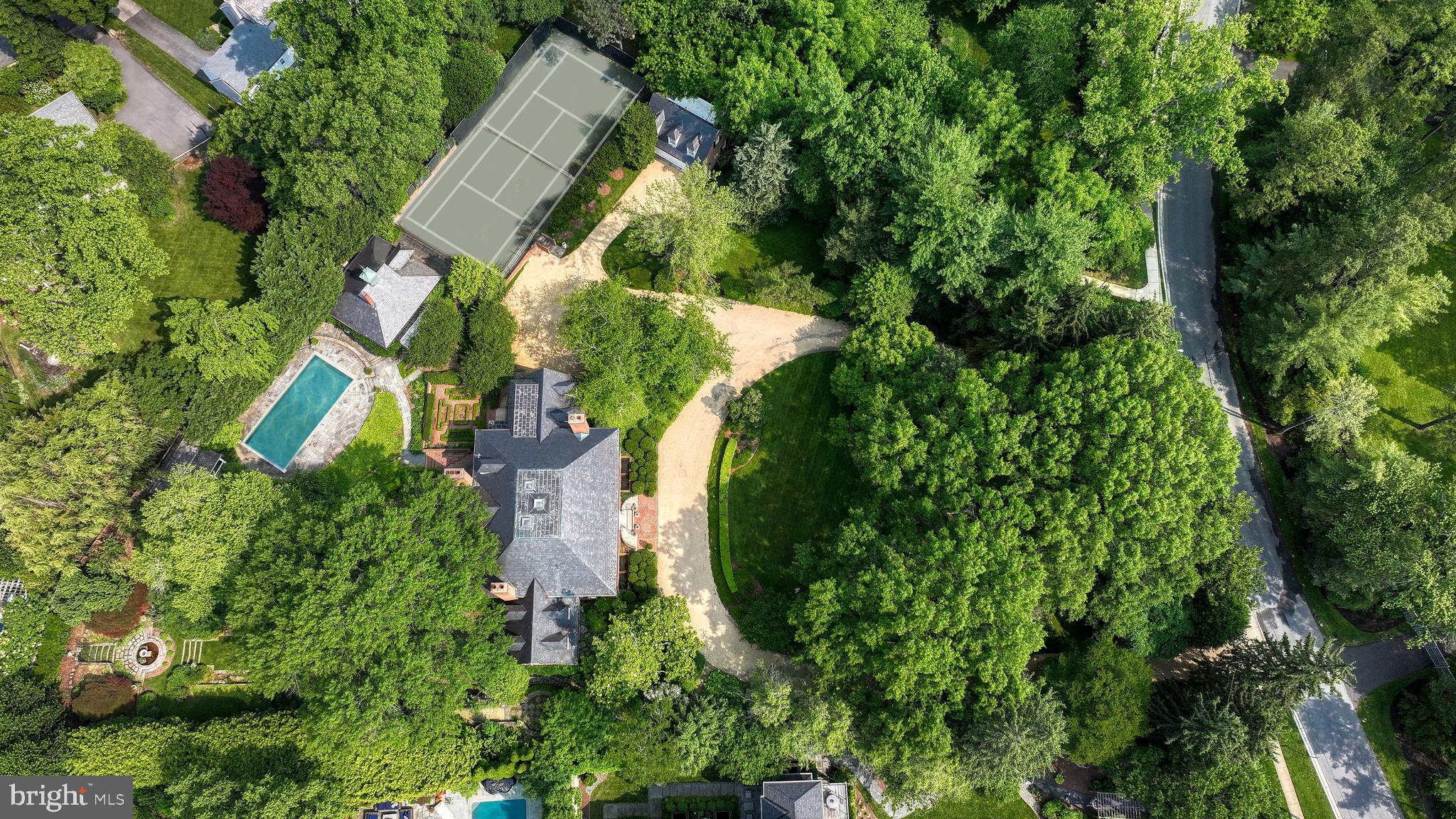 A Once-in-a-Generation Offering. Commanding one of the largest and most coveted parcels in Edgemoor, spanning more than 1.7 acres, this extraordinary estate stands as an enduring testament to architectural artistry and landscape mastery. Conceived by renowned architect Walter G. Peter, Jr., with interiors curated by acclaimed designer Samuel A. Morrow and verdant grounds imagined by Philadelphia landscape luminary Anthony “Tony” Holmes, the result is nothing short of transcendent.

An inspired composition of elegance and romance, the residence is nestled within a botanical sanctuary that rivals the world's most celebrated gardens. Every element of the landscape was meticulously planned for year-round bloom, anchored by specimen plantings, mature trees, and a hardscape that has evolved organically over six decades. These details are simply impossible to recreate.

The stately main residence spans over 12,000 square feet and is accompanied by a sophisticated pool house, tennis court, gardening pavilion, and a detached garage with a full caretaker’s apartment. And yet, despite the estate’s sense of seclusion, it is mere moments from the heart of downtown Bethesda, with premier dining, boutiques, and Metro access just steps away.

This is not simply a home; it is a legacy property, an opportunity to steward one of the Capital Region’s most storied estates.