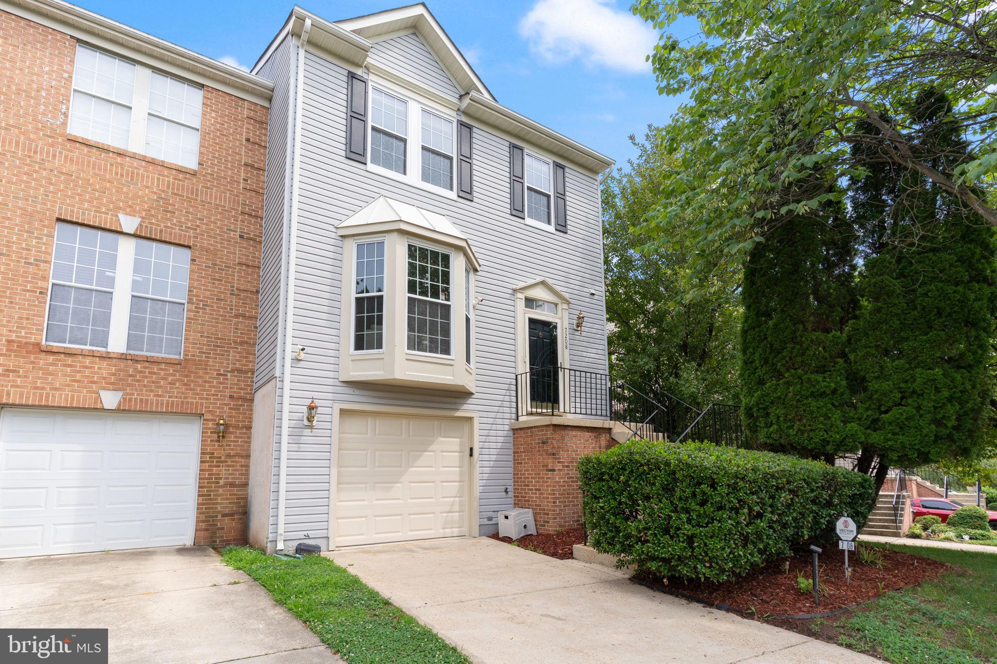 Beautifully updated three-level end-unit townhome with a 1 car garage, offering 3 bedrooms, 2 full baths, and 2 half baths. Recent improvements include fresh interior paint, brand-new carpeting, and a new garage door, making this home move-in ready. The entry level features a spacious recreation room with a wood-burning fireplace accented by a marble surround and oak mantel, recessed lighting, a convenient half bath, a laundry/utility room with full-size washer and dryer, and walkout access to the backyard and deck. The main level offers an eat-in kitchen with durable ceramic tile flooring, 42-inch white cabinetry, a pantry, garbage disposal, and stainless steel appliances including a five-burner gas range, built-in microwave, and dishwasher. The adjoining living and dining areas feature hardwood flooring, a bay window, decorative columns, custom floor-to-ceiling mirrors, and access to a full-width rear deck, providing excellent space for everyday living and entertaining. Upstairs, the spacious primary suite includes a vaulted ceiling, ceiling fan, walk-in closet, and a private bath with a soaking tub, separate shower, and dual-sink vanity. Two additional bedrooms also feature vaulted ceilings and ceiling fans, while the hall bath offers a dual-sink vanity and tub/shower combination.
Additional highlights include hardwood stairs, six-panel doors throughout, gas heat, gas hot water, low-maintenance vinyl siding, and the recent updates that enhance both the home's appeal and value.