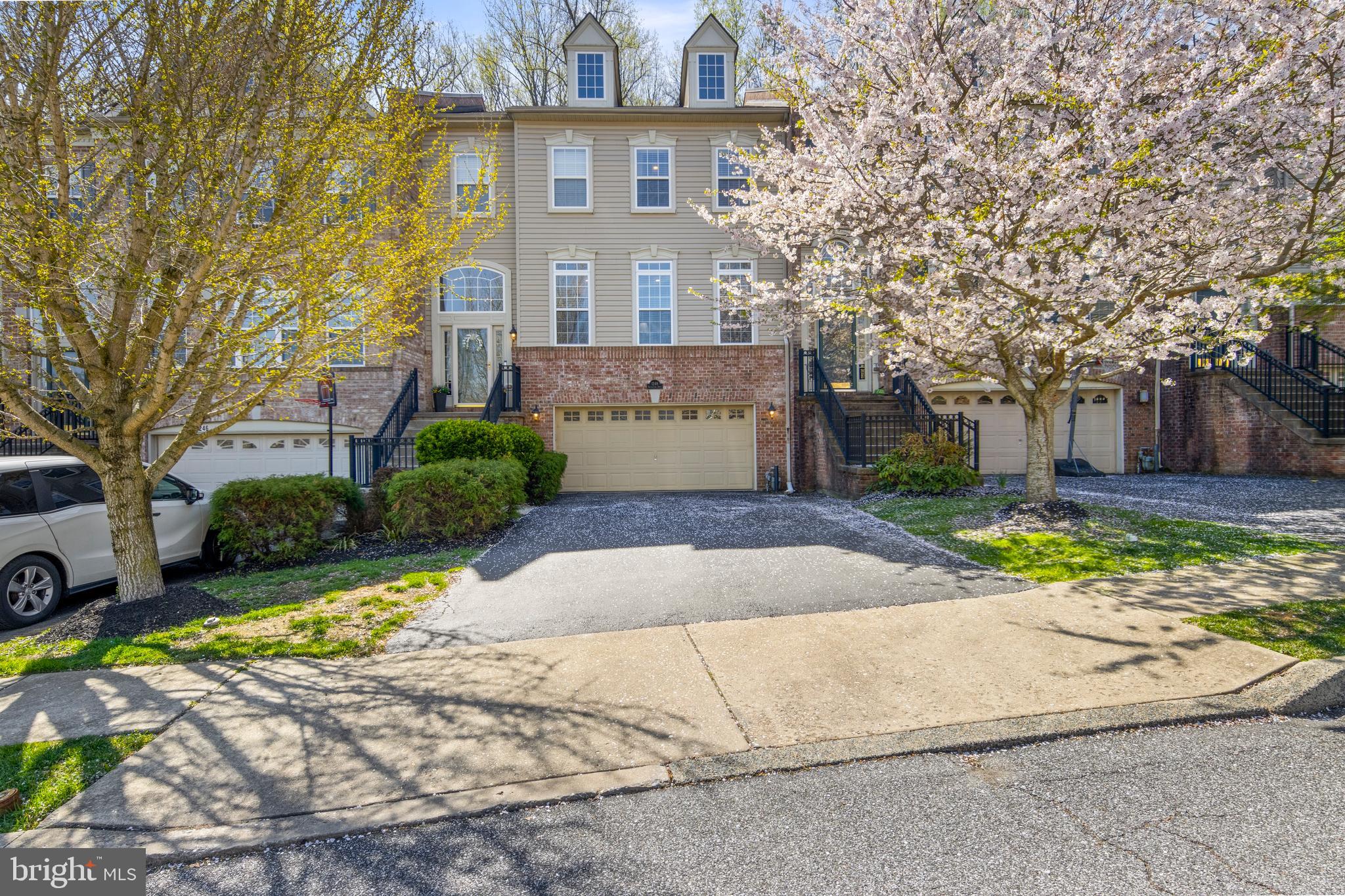 Step into a home that instantly feels like the one you’ve been waiting for. Nestled in the award-winning Garnet Valley School District, this beautifully maintained townhome blends elegance, comfort, and everyday convenience in all the right ways.  From the moment you enter, the welcoming foyer sets the tone with its soaring vaulted ceiling and open staircase, a bright and airy introduction to what lies ahead.  The main level unfolds with a seamless open-concept design, where rich hardwood floors and recessed lighting create a warm, polished feel throughout.  Sunlight pours through oversized windows in the living room, while graceful archways with classic columns guide you into the dining room and family room, each space thoughtfully designed for both entertaining and relaxed living.  A cozy fireplace anchors the family room, making it the perfect place to gather.  At the heart of the home, the kitchen shines with timeless style and functionality. Featuring 42" white cabinetry, a ceramic tile backsplash, and bi-level granite countertops with a breakfast bar, it’s a space that’s as practical as it is inviting.  Sliding glass doors lead to an expansive deck, ideal for morning coffee or evening unwinding, overlooking a peaceful, wooded backdrop and offering direct access to the rear yard.  Upstairs, the primary suite is a true retreat. With its dramatic vaulted ceiling, dual walk-in closets, and spacious layout, it offers both luxury and comfort. The en-suite bath is equally impressive, complete with double vanities, a Jacuzzi tub, and a seamless glass walk-in shower.  Two additional bedrooms and a well-appointed hall bath provide plenty of space for family or guests.  The lower level adds even more versatility, offering a comfortable escape perfect for entertaining, a home office, or a media room, complete with a convenient half bath.  A two-car garage adds everyday ease and ample storage.  Perfectly situated, this home offers access to nearby parks, jogging trails, and playgrounds, while being just minutes from tax-free shopping in Delaware. Commuters will appreciate the easy access to Center City Philadelphia and the airport.  Meticulously cared for and move-in ready, this is more than just a home, it’s a lifestyle upgrade.