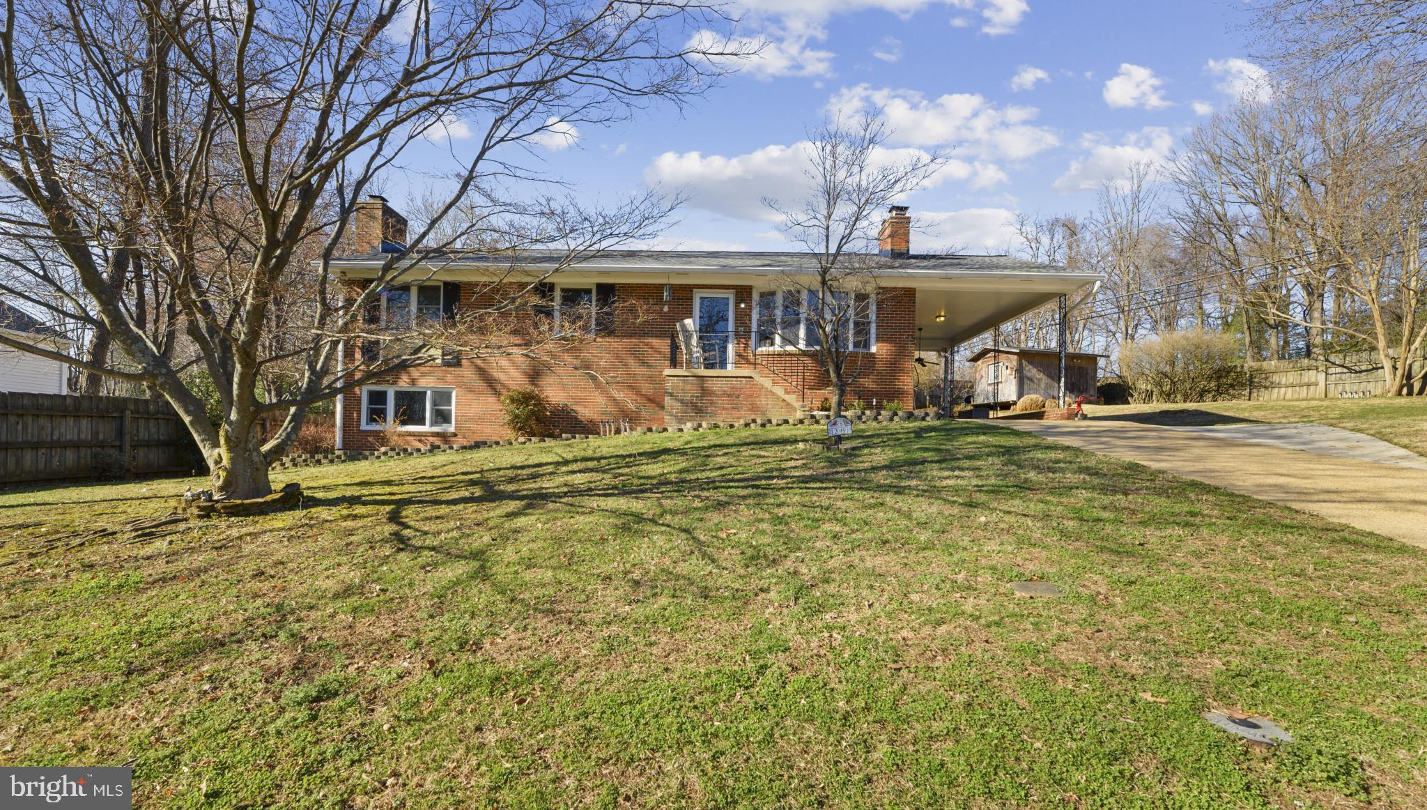 Welcome to this charming all‑brick rancher in the highly desired Rolling Knolls community! This well‑maintained home offers a warm and inviting layout featuring hardwood floors throughout, a spacious primary suite with sitting area (formerly 3 bedrooms), and Pella windows that bring in beautiful natural light. The cozy lower level is perfect for relaxing or entertaining with its nautical charm, built‑in bar, bonus room/den, pellet stove, and convenient walkout to the backyard. An additional unfinished area provides fantastic space for a workshop or storage. Outside, enjoy a side patio, shed with electric, carport, and concrete driveway with extra side parking, great for guests or work vehicles. With thoughtful updates, solid construction, and an excellent price point for Rolling Knolls, this home offers exceptional value in a wonderful community with its own elementary school. Fantastic location, ideal for commuting to Washington, DC or Baltimore, and just minutes to historic waterfront downtown Annapolis, local bars, shops, restaurants, and Luminis Medical Center.  A must-see for buyers seeking comfort, character, and convenience in Annapolis!