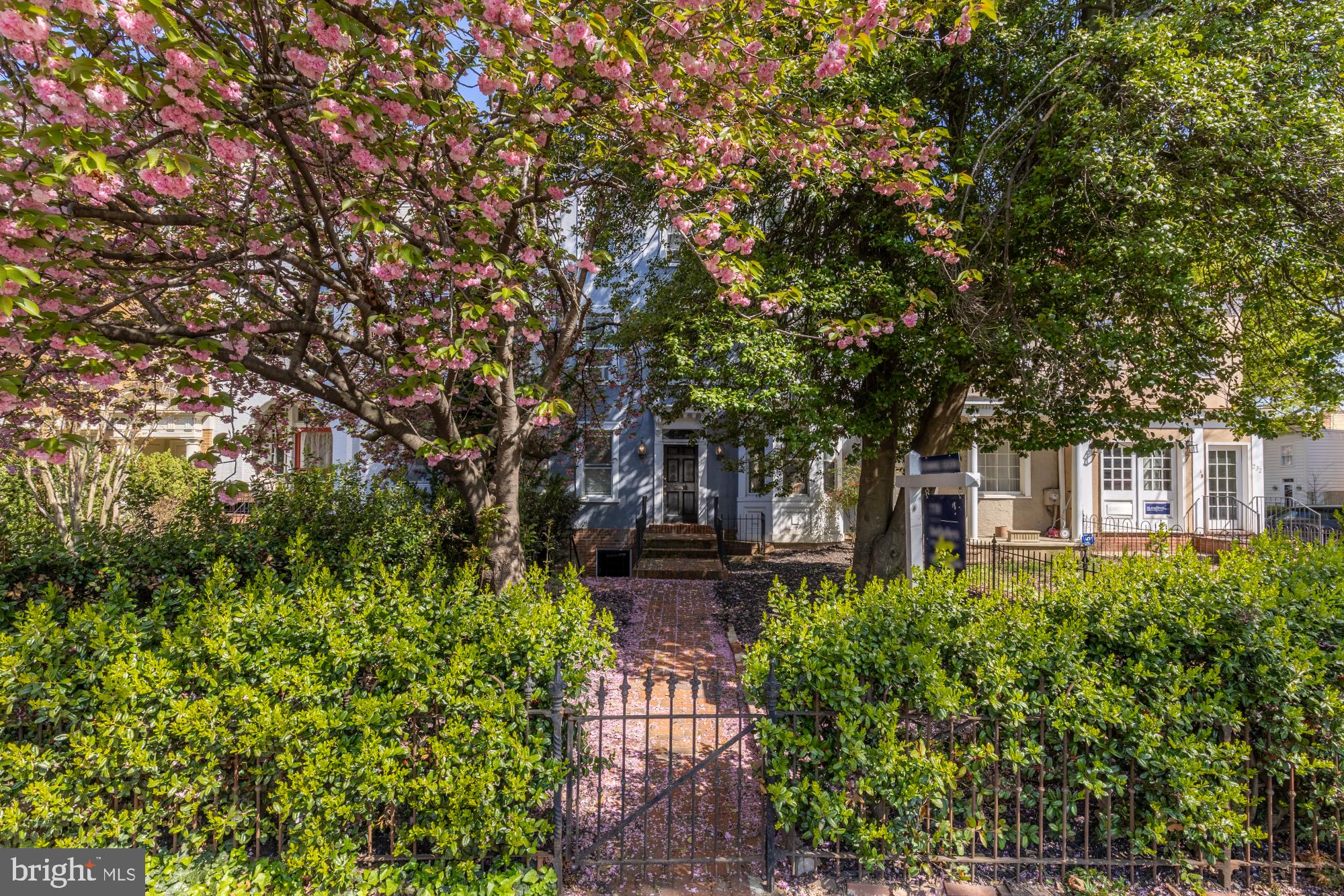 Positioned on the coveted 200 block of East Capitol Street, just steps from the Supreme Court and the grounds of the U.S. Capitol, this exceptional multi-unit residence offers a rare opportunity to own a piece of Washington’s earliest residential history. With origins believed to date to the pre–Civil War era, the property stands among Capitol Hill’s oldest surviving structures—part of a small collection of early homes that helped shape the neighborhood as it evolved alongside the nation’s capital.

Spanning nearly 4,500 square feet, the building is configured as two distinct units, offering both immediate income potential and long-term flexibility. The lower level (Unit 2) features a well-proportioned two-bedroom, two-bathroom layout, while Unit 1 spans the main and upper two levels, offering an expansive eight-bedroom, four-bathroom residence with remarkable scale rarely found in this location. This configuration presents a wide range of opportunities, from investment and rental income to multi-generational living or a conversion back to a grand single-family home.

Throughout its history, the property has been owned and occupied by professionals including physicians and government-affiliated residents, underscoring its longstanding connection to the civic and political fabric of Washington. The size and layout reflect a legacy of both residential and professional use, offering a unique foundation for a variety of future uses, including boutique residential, co-living, or continued multi-unit income production.

Rich in character, the interiors feature hardwood floors in excellent condition, two fireplaces, and architectural elements that speak to its historic construction, including substantial masonry, original proportions, and details preserved through generations of thoughtful adaptation. A distinctive circular staircase leads to the roof, presenting the opportunity to create a private outdoor setting with views over one of the city’s most iconic corridors.

The rear of the property offers a rare parking pad accommodating four or more vehicles—an invaluable amenity on East Capitol Street. Beyond the home, the surrounding neighborhood carries unparalleled historical and cultural significance. East Capitol Street is one of Washington’s most prominent and ceremonial avenues, lined with stately residences and anchored by landmarks including the Library of Congress, the Supreme Court, and the U.S. Capitol. For generations, this area has drawn lawmakers, dignitaries, and professionals seeking proximity to the center of government and the enduring prestige of Capitol Hill.

Combining scale, income potential, and irreplaceable historical provenance, this property presents a truly unique opportunity—whether as a strategic investment, a legacy asset, or a reimagined residence in one of Washington’s most distinguished settings.