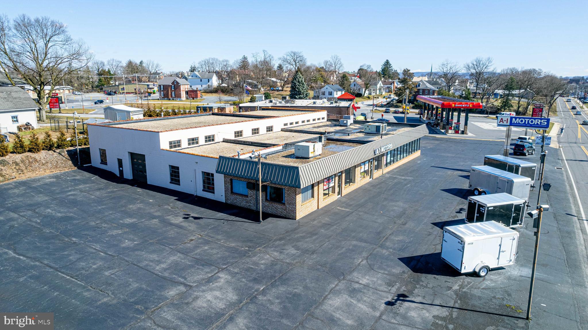 This well maintained commercial building is being now offered publicly for sale for the first time.  With over 10,000 square feet of usable space under roof, and over ONE ACRE in the Borough of Chambersburg - this property offers opportunity for a various assortment of ventures. Enjoy excellent exposure and a high traffic count. This property is conveniently located on a main artery.  Many uses possible - refer to zoning.  This custom built facility offers a mixture of office, meeting, retail/showroom, warehousing and workshop space. The rear workshop / warehouse offers three loading doors and 14 foot ceilings. The possibilities are endless.  Will your business be the next to thrive here?