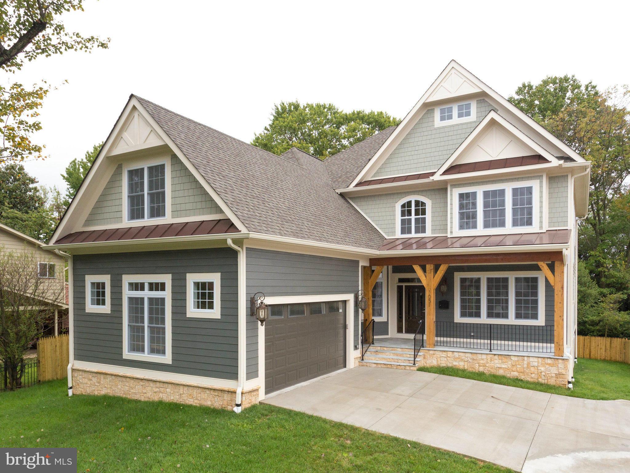 New, elegant brick and iron fence with automatic gate on this luxury home. This 6,411sq.ft craftsman is situated on .25 acre and offers a spacious, yet cozy, family room with cedar coffered ceiling+stone fireplace. Also included are built ins, gorgeous floor to ceiling bay windows, deck off family room and functional mudroom. Basement is walk out and includes pre-wired theatre, wet bar, fireplace.