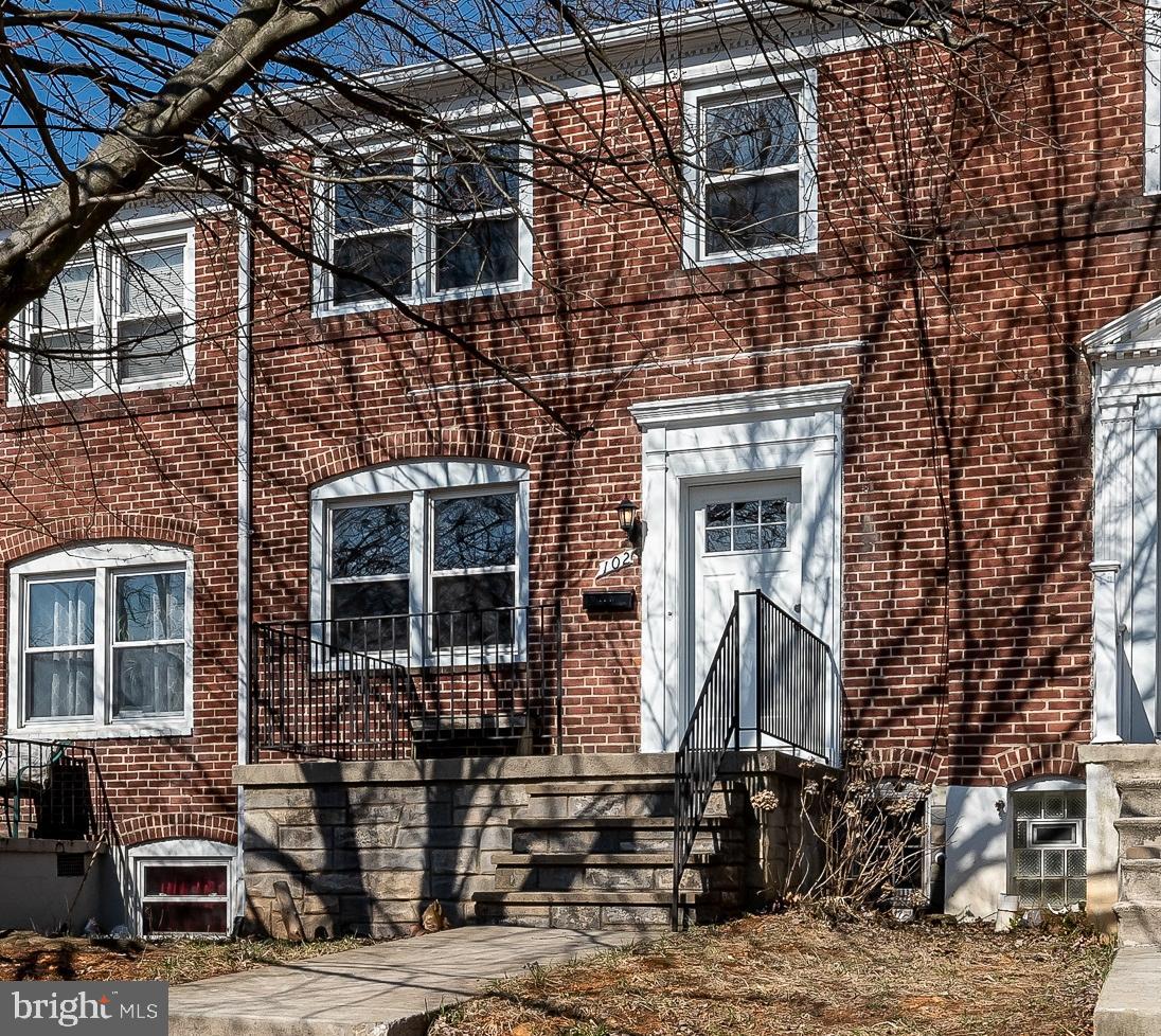 Sunlit and sensational, this all-brick townhome along the outskirts of Catonsville has the charm and quality in craftsmanship of an older house coupled with the conveniences of modern-day amenities!  It boasts a renovated kitchen with brand new Shaker-style cabinets, granite countertops, stainless steel appliances (including a built-in microwave), undermount sink, center island w/ breakfast bar, and a pantry... All of which flows right into the the dining and living areas to encourage family togetherness... The three spacious upper level bedrooms - which provide options for slumber and/or study - share a full bathroom... And the finished basement with rear entrance includes a den/possible 4th bedroom, a full bathroom, separate laundry room (with full-size washer/dryer & extra freezer), and a workshop...  Once outside, set up a hammock in your fenced rear yard for chilling while the nearby deck is ideal for grilling!... Additional features include: real hardwoods on the main & upper levels, fresh paint,  knotty pine paneling (lower level), some updated lighting (fixtures & recessed),  ceiling fans, built-in shelving... Not to mention that you will be just 1 block away from the community park; and the home is near a plethora of shopping options, restaurants, and major commuter routes...  Take advantage of outstanding interest rates and make your dreams of becoming a homeowner in 2021 a reality!