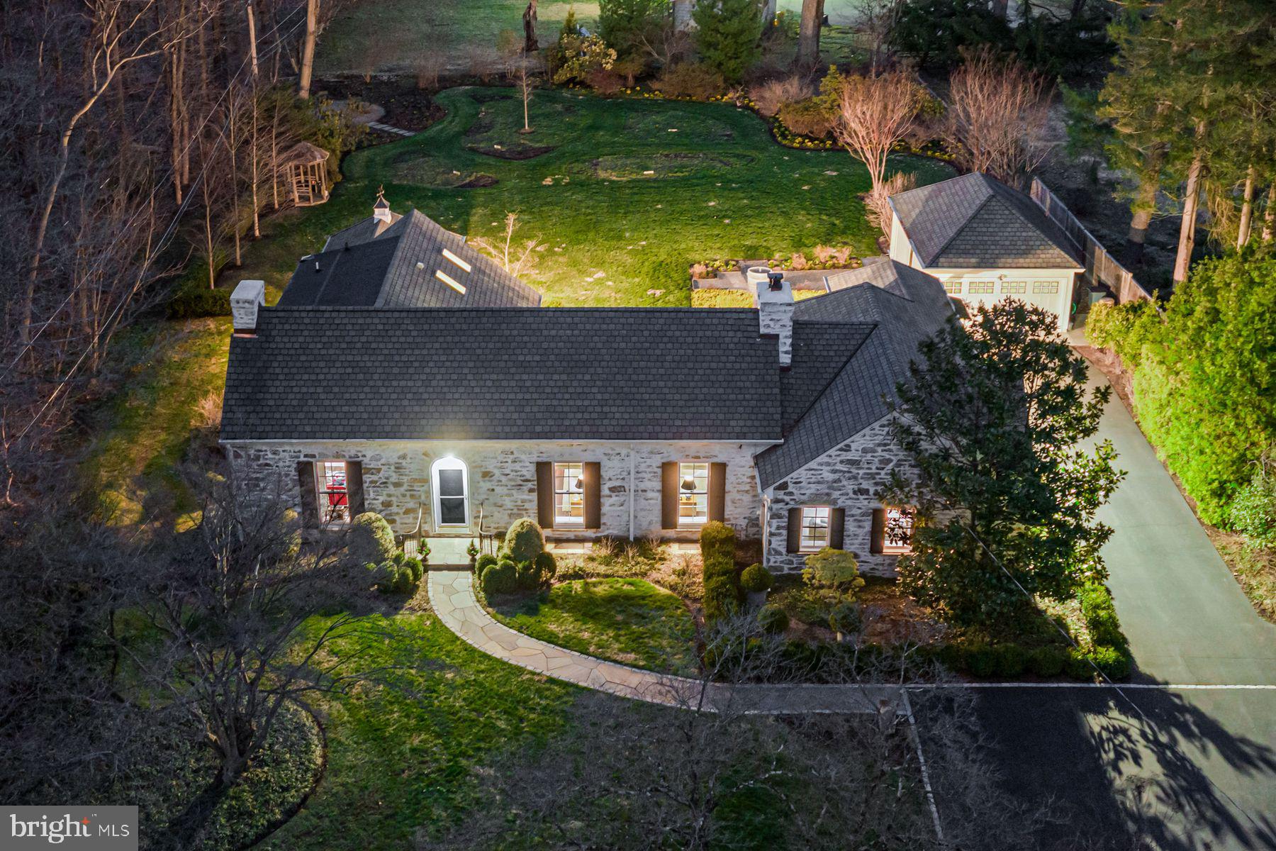 Charming perfection at every turn!! Look no further and enjoy this beautifully and completely renovated residence, set on a breathtaking, flat lot .97 acre lot, adjacent with direct access into the Idlewild Preserve offering peaceful walking trails and serene views. Endless improvements include fabulous hardwood floors throughout, neutral decor with custom lighting, large sun-filled windows looking out over the colorful gardens designed by Chuck Hess, inviting great room with original restored built-in and moldings opening up to the spacious dining room area and incredible new gourmet kitchen with custom cabinets, marble countertops, SubZero refrigerator/ freezer, 6-burner Thermador range and Thermador dishwasher, spacious library with access to a beautifully renovated marble bathroom, luxurious first floor Primary Suite with trayed ceiling, custom decor, tall, bright windows and French doors leading out to the expansive rear terrace and grounds and an incredible custom designed marble bathroom with soaking tub and oversized frameless glass shower and a second first floor guest/ in-law suite at the other side of the house with newly renovated full marble bathroom. The second level offers two additional spacious bedrooms with a beautifully renovated marble bathroom.  The dry lower level showcases the new systems and offers lots of storage as well as room for future recreation rooms. Enjoy this stunning Gladwyne oasis while being n close proximity to renowned schools, the wonderful town of Gladwyne, all forms of transportation, incredible restaurants and more! A rare gem!