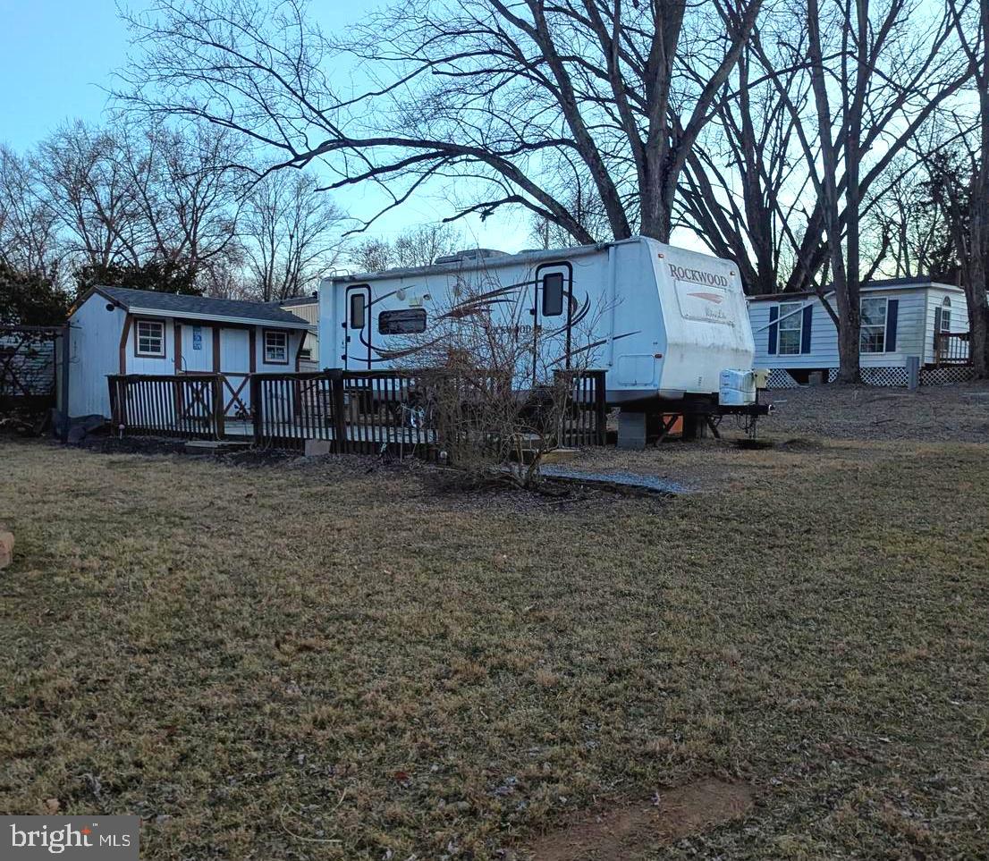 ***Property Details *** Great Level lot with views of the river **Lot only, Camper not included. **
Great level lot has some partial river views.  This lot comes with a deck and shed.  
Shed has electric.   Bring the family and live the river life.  Come and check out this amazing lot ***BRING YOUR BEST OFFER*** YOU WON'T WANT TO MISS THIS ONE. 

This is a gated community, so you need to enter at the guard shack. Entry is not permitted without ID per the office rules. Bring IDs to the office or guard shack for visitor pass. THIS IS A SEASONAL CAMPGROUND! OPEN FROM APRIL 1 TO NOVEMBER 1. ** WELCOME TO RIVER BEND/SEASONAL LOT AVAILABLE TURNKEY** River Bend is a privately owned 400 acres recreational- vehicle camp resort with seasonal activities for members, families and guests. This great RV park is tucked away on the Upper Potomac River of West Virginia; River Bend is one of West Virginia's most popular family seasonal destinations.  Just a short drive from the Washington and Baltimore metro area. Open with utilities from April 1 to November 1. Lot owners have access to their property the entire year. *** Members Enjoy *** * Amazing views and wildlife, Potomac River access, Trails, Swimming pools, Mini-Golf, Youth center, Tennis and basketball courts, laundry facilities, convenience store, deli and lounge. *Bath houses throughout the park, boat ramp, bar and grill and even a church located on the grounds. River Bend also hosts numerous activities such as 4th of July fireworks, small carnival, bonfires, poker runs, horseshoe tournaments, car show, Halloween Trick or Treat and so much more.
