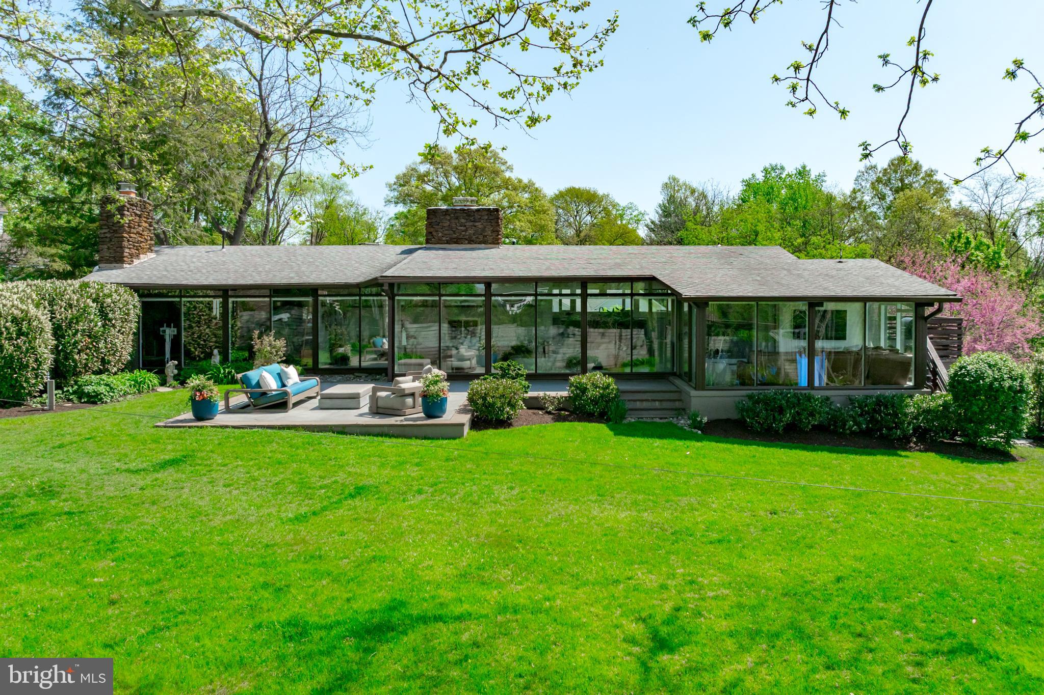 **Offer Deadline 3:30PM Monday April 20th** Iconic Deck Home in Pendennis Mount with views of the Severn River. (Interior Photos Coming Soon) This remarkable mid-century modern home has been meticulously renovated from top to bottom—and the result is something truly special. Dramatic post-and-beam construction, cathedral ceilings, and walls of glass flood the home with natural light and connect every room to the outdoors, while the open floor plan makes it as livable as it is stunning. A perfect place to enjoy views of the Naval Academy, the Blue Angels, and fireworks!
Every inch has been thoughtfully upgraded with designer-selected finishes, Restoration Hardware lighting throughout, Roman clay paint in the primary bedroom, and custom California Closets in every room. The magazine-featured chef's kitchen is the heart of it all—completely reimagined with quartz countertops, a custom breakfast nook, and a beautiful walnut built-in corner dining bench. Hardwood floors flow through the open main level, anchored by custom walnut built-in shelving in the living room and a study with custom built-in cabinetry. One of the home's most charming surprises is a beautiful sitting room off the primary suite—ideal for working from home with a view—with a secret door hidden in the bookshelves that leads directly to the bedroom. The main level primary suite itself is a true retreat, finished with a beautifully designer-renovated bath (with Restoration Hardware vanity). New HVAC units (2025), new windows and sliding glass doors, and Hunter Douglas motorized shades complete the picture.
The finished lower level is more than just extra space—it’s a home within a home. A second family room with walk-out access to the rear yard anchors the level, joined by three bedrooms and a newly created room that works beautifully as a fifth bedroom or a second private home office. Whether it’s a quiet workspace, a guest suite, or a hangout for the kids, the lower level has the flexibility to grow with you
The owners spared no expense on the outdoor spaces—and with over 18,000 square feet, a flat rear yard, and beautifully designed areas front and back, this is rare for the area. Out front, a new flagstone entry patio (2021) sets a beautiful tone of arrival, with a firepit and ample seating. Out back, there is a stunning IPE deck with built-in storage, a new concrete patio and professional landscaping make every day feel like a weekend. An irrigation system keeps everything looking its best year-round. 
Living in Pendennis Mount means having it all right at your fingertips. Water access to the Severn River is just steps away, right next to the beloved Severn Inn Restaurant. Stroll to the B&A Trail for a morning run with views of the WWII Memorial, the Route 450 bridge, and the Naval Academy. A quick walk brings you to all of downtown Annapolis—shops, restaurants, and the waterfront. Minutes from Jonas Green State Park, Navy Stadium, Naval Academy Golf Club, and more, this community puts the best of Annapolis right at your doorstep. Served by the highly regarded Broadneck school district. Come make this your new home!