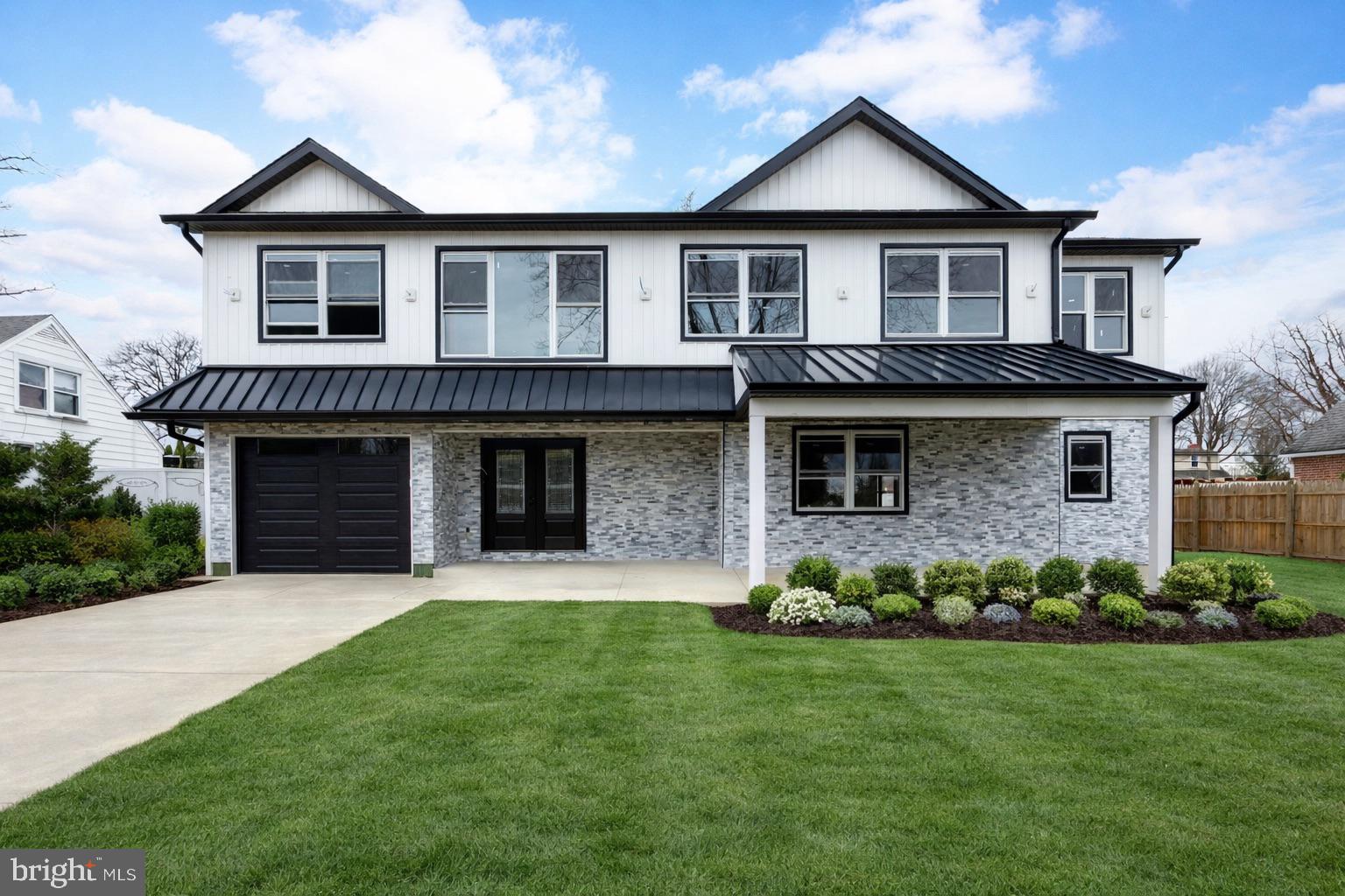 House is not yet completed.  Please contact listing agent to preview property. Listing agent must be present to show.  
 
Welcome to over 4,000 square feet of stunning, light-filled luxury in the heart of Marple Township! This essentially brand-new home has been completely reimagined with high-end finishes and top-to-bottom upgrades—everything is new, including plumbing, electrical, roof, windows, HVAC, tankless water heater, sewer line, and more. From the moment you step inside, you're greeted by an expansive foyer and beautiful solid hardwood floors that flow seamlessly throughout the home. The first floor offers a spacious open-concept layout designed for modern living and effortless entertaining. A main-level in-law suite with a private bath and walk-in closet provides the perfect space for guests or extended family. The kitchen is truly the heart of the home—expansive and thoughtfully designed with premium appliances, quartz countertops, a stylish tile backsplash, and not one, but two oversized islands ideal for hosting gatherings. Sliding doors lead to a Trex deck, perfect for enjoying your morning coffee or relaxing outdoors. The finished basement adds even more living space and includes a convenient half bath. Upstairs, you'll find four generously sized bedrooms. The primary suite is a true retreat, featuring a large walk-in closet and a private spa-like bathroom with a soaking tub and walk-in shower. A second bedroom offers its own en-suite bath, while the remaining two bedrooms share a well-appointed hall bathroom with a tub. A second-floor laundry room adds everyday convenience. Additional highlights include an oversized attached garage with the ability to accommodate two cars in tandem, a newly paved driveway, fresh landscaping, and a charming front façade that fits beautifully within the neighborhood. Situated on a sidewalk-lined street just minutes from everything Broomall has to offer, this move-in-ready home is not to be missed.