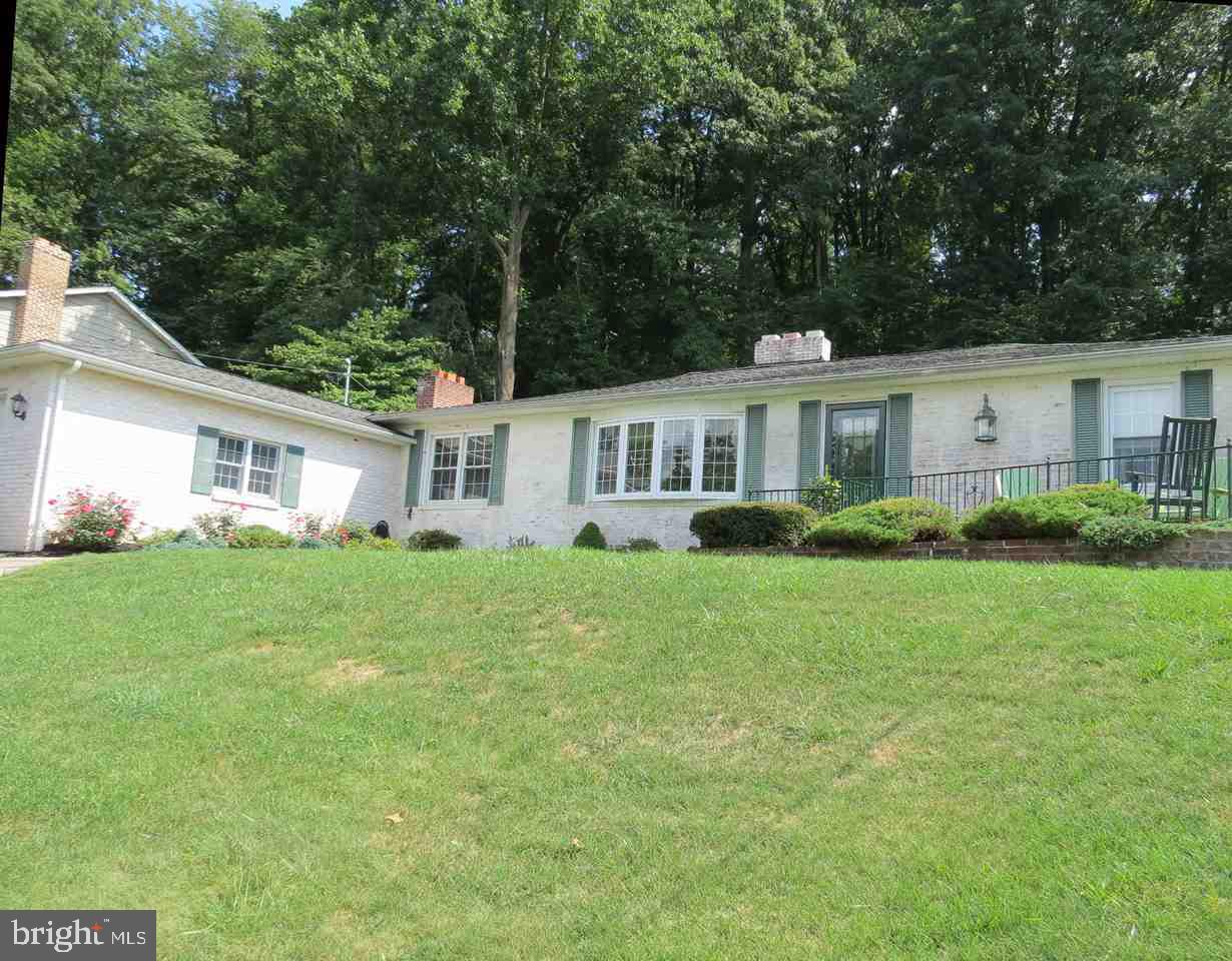 Beautiful, must-see ranch with 4 bedrooms, 2.5 baths and finished basement. Enjoy the wonderful landscaping on the screened-in porch out back or the large patio out front. When the weather turns colder, enjoy the 3 fireplaces! Hardwood floors. Updated kitchen. Newer windows/doors. This home has a large feel with a formal living room, family room, rec room and large screened-in porch. Plenty of room for the family to spread out. Large lot is over 3/4 acres.