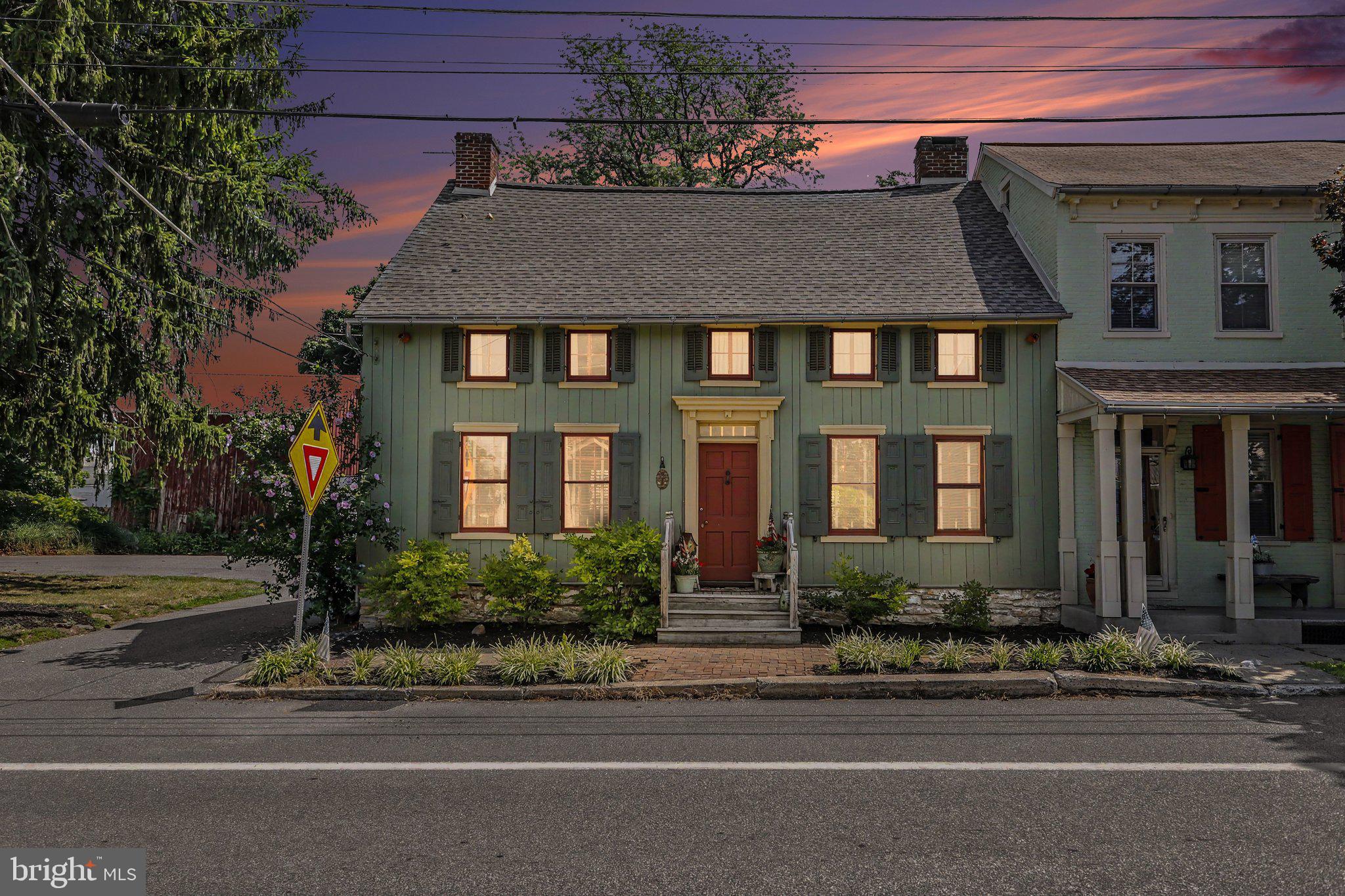 Lovingly maintained and affectionately known as "Old Glory" by its current owner, 10 S. River Street is a rare opportunity to own a remarkable piece of Maytown history. Dating back to the late 18th century, this beautifully restored log home showcases traditional Germanic craftsmanship with an English-style floor plan featuring two rooms on either side of a central hallway and classic end chimneys.
Thoughtfully restored in the 1980s while preserving its historic integrity, the home is rich with timeless character. Wide-plank hardwood floors, grain-painted doors with period hardware, two fireplaces, and charming built-in cupboards—worthy of inspiring dreams of a secret passage to Narnia—create an atmosphere that is both warm and unforgettable. Offering generous living spaces, the flexible floor plan allows for a variety of layouts, including the potential for convenient first-floor living. Upstairs, central air conditioning provides modern comfort, while spacious bedrooms and a delightful skylight room offer cozy retreats filled with natural light and character. Step outside to enjoy the detached two-car garage with an attached "she shed," perfect as a studio, workshop, or private escape ,also complete with electric and a loft area for added storage. The inviting patio,dubbed "The Nest"  is ideal for relaxing summer evenings, surrounded by beautifully established gardens bursting with hydrangeas, coneflowers, and a colorful collection of perennial blooms. Historic homes of this caliber are seldom available. Come experience Old Glory for yourself and discover the craftsmanship, charm, and timeless beauty that have captivated generations.