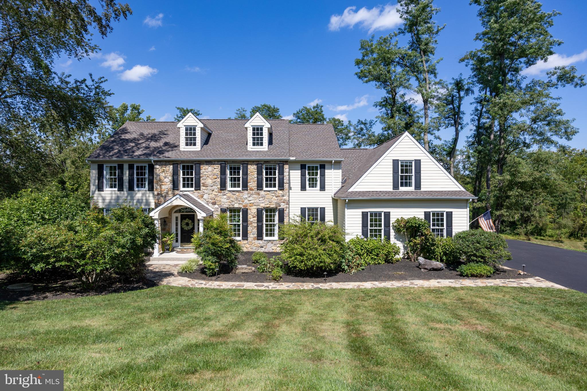 Nestled on a serene 1.22-acre lot in the highly sought-after Unionville-Chadds Ford School District, this exceptional 4-bedroom home with a bonus room and 3 full baths offers over 5000 sq. ft. of exquisitely designed living space. The first floor showcases a thoughtful layout with both style and function, including a stunning kitchen with refinished cabinets, stainless steel appliances, and an open floor plan that flows seamlessly into the family room with a cozy gas-burning fireplace. Two sets of stairs enhance accessibility, including a convenient back staircase off the kitchen. The living room features a second gas-burning fireplace, perfect for entertaining or relaxing, while the dining room is adorned with elegant grass cloth wallpaper, creating a sophisticated space for gatherings. Completing the first floor are a well-appointed office with built-ins and grass cloth wallpaper, a mudroom with built-in storage, and a convenient laundry room, combining everyday practicality with luxury finishes
Upstairs, the primary suite is a private retreat, featuring a remodeled spa-like bath with heated floors (2024) and  a custom walk-in closet that is both a fashionista’s dream and a model of organization.The second floor also includes three additional sizable bedrooms and closets a newly updated hall bath (2024), and a bonus room with its own full bathroom, providing flexible space for guests, media, or play. The finished walkout basement, newly carpeted in 2024, offers versatile space for a media room, gym, or playroom.
This home has been thoughtfully updated with premium features, including a new roof (2024), dual HVAC units (2020), water heater (2019), and new garage doors with electric openers (2022), providing peace of mind alongside modern luxury. Outside, the expansive deck and lot offers ample space for outdoor activities or serene relaxation.
Ideally located, this exceptional property is close to both the vibrant West Chester and Kennett Square boroughs, with convenient access to all major routes, combining timeless updates, luxurious finishes, abundant space, and a prime location for an elevated lifestyle.