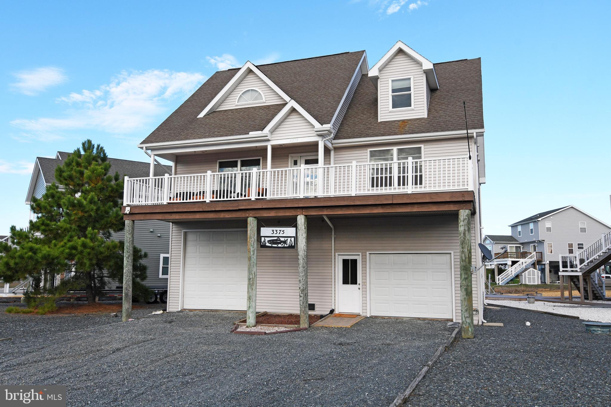Nestled along a tranquil canal, this lovely 4 bd, 3 ba piling home in Captain’s Cove offers the perfect blend of comfort & coastal charm. Inside the open-concept layout connects the kitchen, dining & living areas, forming the heart of the home & showcasing beautiful water views, ideal for entertaining or relaxing. Two bedrooms & a full bath are located on the 1st floor, while the 2nd floor features 2 more beds & baths, including a spacious primary suite. All bedrooms boast hardwood floors, adding warmth & elegance. Enjoy time outside on one of the two spacious decks. You have direct views of the launch pads at Wallops Island from the front porch! A convenient lift provides easy access from the ground to the first floor. Enjoy the peaceful waterfront lifestyle Captain’s Cove is known for.