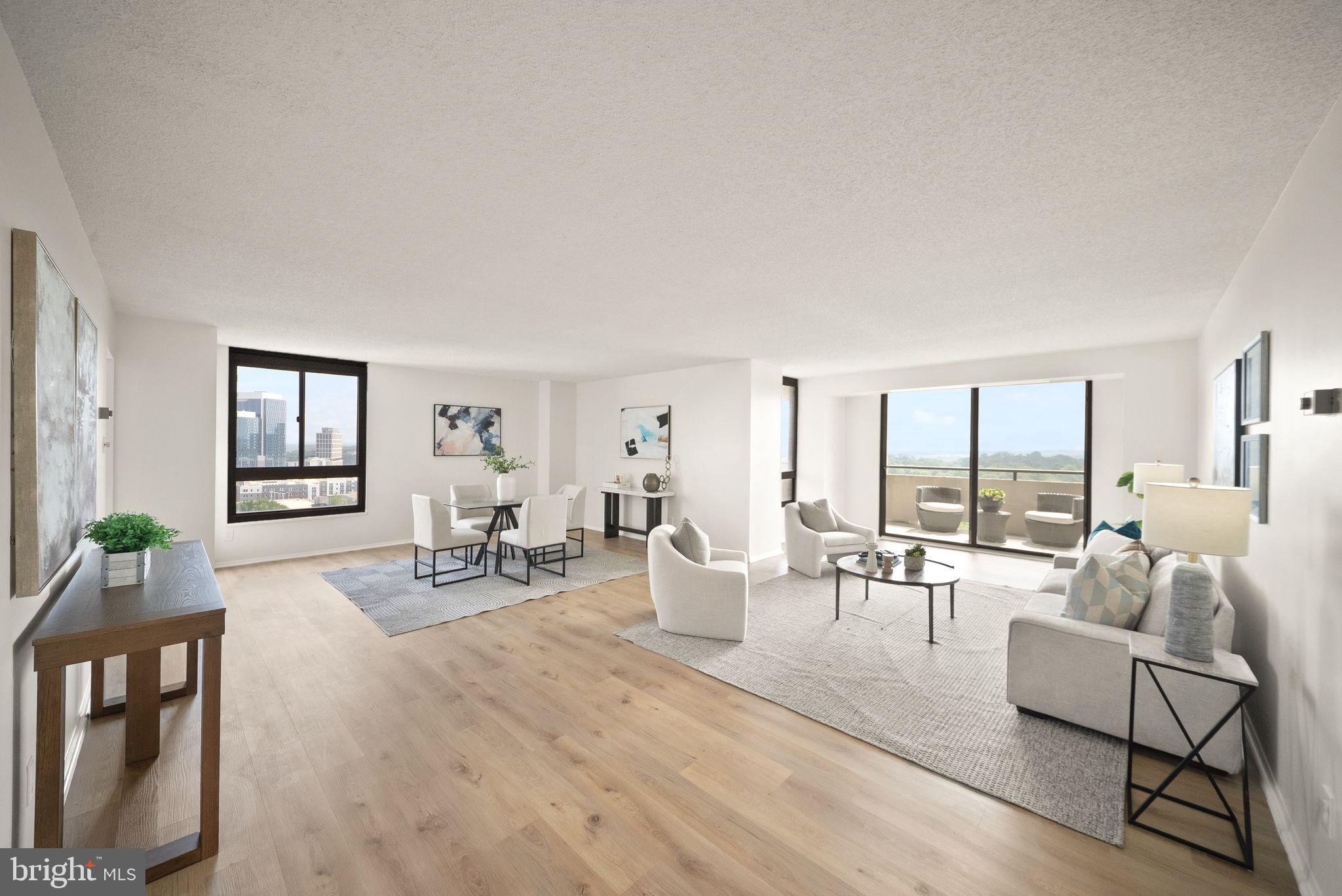 This rarely available, spacious, sun-filled corner unit boasts grand views and large balcony that truly sets it apart. Perched high on the 16th floor, this 1,476-square-foot home offers a rare combination of scale and natural light, with windows on multiple sides that fill the space with warmth throughout the day. Even more unique, the unit includes 2 deeded garage parking spaces - an exceptional and highly sought-after feature.
Step inside to find fresh paint and new luxury vinyl plank flooring, giving the home a clean, updated feel from the moment you arrive. The layout is both spacious and inviting, centered around a generous living and dining room combination that’s perfect for gathering and entertaining.
Just beyond, the space opens seamlessly onto a wraparound balcony - a true highlight - creating an incredible indoor-outdoor flow that expands your living space and makes hosting effortless.
The eat-in kitchen offers a comfortable setting for everyday meals, while the open living area allows for larger gatherings. The primary suite features a walk-in closet and a private bath, while the second bedroom also includes a walk-in closet, offering flexibility for guests or use as a home office. The in-unit washer and dryer, and extra storage bin are a welcome convenience.
Residents enjoy a gated community with 24-hour lobby attendant and access to three outdoor pools. 
A 24-hour fitness center is attached to the building, with tennis and pickleball available through a separate membership. The condo fee includes all utilities, offering simplicity and value.
The location puts you close to everything that makes Tysons so dynamic. Just minutes away is The Boro, a vibrant, walkable district known for its mix of restaurants, cafés, boutique shopping, and entertainment. You’ll also find The Perch, a unique elevated park and gathering space atop . Nearby, Tysons Galleria and Tysons Corner Center provide world-class shopping and dining, while the Silver Line Metro and easy access to Route 66 and I-495 simplify commuting.
For outdoor enjoyment, nearby parks and scenic trails offer a perfect balance to the urban setting - ideal for walking, jogging, or simply relaxing.
Homes that offer this combination of size, light, outdoor space, location, and rare deeded parking don’t come along often; come see what makes this one stand out. See  VIRTUAL TOUR !