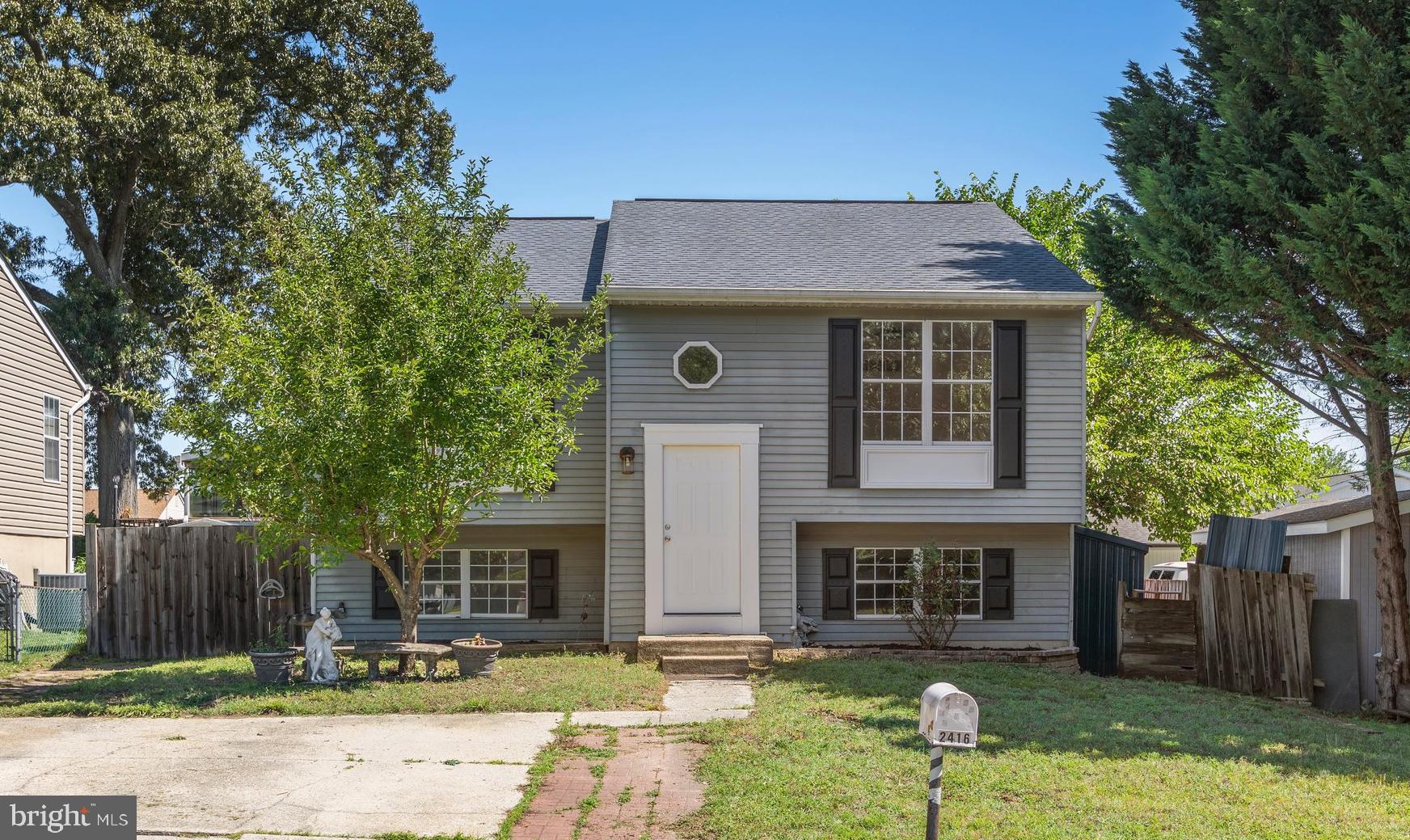 Situated in the convenient Green Haven subdivision, this delightful split foyer home offers a perfect blend of comfort and functionality. Built in 1987, this residence has been thoughtfully designed to cater to modern living while maintaining a warm, inviting atmosphere. As you step inside, you are greeted by an open floor plan that seamlessly connects the kitchen and living areas, creating an ideal space for gatherings and everyday living. The combination kitchen/living area is enhanced by elegant crown moldings, new fixtures, fresh paint and features luxury vinyl plank flooring, providing both style and durability. The eat-in kitchen is a true highlight, boasting ample table space for casual dining, and is equipped with essential appliances. This home offers four spacious bedrooms, each designed to provide a restful retreat. The primary suite features a generous walk-in closet, ensuring you have plenty of storage space for your belongings. The two full bathrooms are well-appointed, catering to the needs of a busy household. The finished basement is a versatile space that can be tailored to your lifestyle. The basement also includes an outside entrance, making it easy to access the backyard. Step outside to enjoy the patio, a lovely spot for outdoor relaxation or entertaining. Parking is a breeze with a driveway that accommodates two vehicles, along with on-street options for guests. This home is not just a place to live; it's a sanctuary where memories are made. With its inviting features and thoughtful layout, it's ready to welcome you home. Don't miss the opportunity to make this charming residence your own!