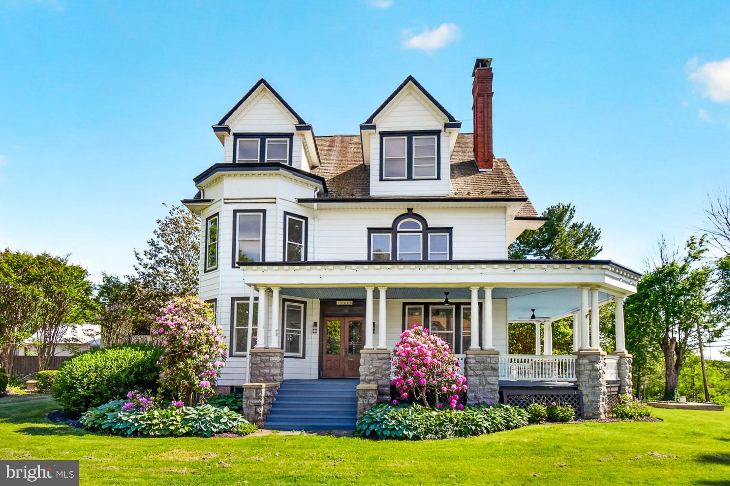 Open Saturday (6/6) from 3-5 PM! This one has to be seen to be believed! One of the most recognizable, beloved, iconic, and stately Victorian-era homes in all of Montgomery County is now available to be purchased and it does not disappoint! Yes, the "grand dame" of Barnesville, positioned on almost an acre and a half, includes 5+ bedrooms and four full baths in the main home, incredible (and circa 1900) hand-crafted wood trim, tall ceilings on all levels, thick hardwood floors, a private guest apartment above the garage, a gorgeous swimming pool with pool house, and a barn big enough to hold an indoor basketball court (the "Barnesville game"), is ready for it's next chapter in life.  Treat yourself for a stroll on the wrap-around porch before you enter the double-foyer with every single bit of its original wooden columns, doors, and trim restored to their natural beauty. The main floor has all the space you need, including  a large eat-in kitchen, formal dining room,  living room with wood burning fireplace, and a private professional office with high-speed FIOS internet. Make your way up the grand staircase (there is a back staircase too!) to the first bedroom level, where the primary bedroom (with fireplace, of course) and en-suite bath await you, along with three other generous bedrooms and another full bath. One more level up (there are 5 levels to this gem!) is an entire floor of three more bedrooms (with balcony overlooks!), a full bath, 2nd kitchen, and laundry space --- perfect for a second family, multi-generational living, or rental income. Go up ONE MORE FLOOR to finished attic space that can serve as another private suite, office, or children's playroom (check out the cubby hole rooms!). Even the basement is dry, open, and perfect for storage or your workshop! It doesn't stop there. The deep detached garage has room for two cars (currently hosting  the amazing Rustic Route coffee roastery!) and features a finished apartment and full bath with separate entrance above it.  The beautiful pool is just steps away from both the main home and the garage/apartment---this is your home for the summer! Finally, the barn is more than just a barn. It's a wide-open and level warehouse for all of your hobbies, cars, kids activities, community meet-ups, and indoor sports (it's time to bring your hoops talents to Barnesville!). Plenty of parking for your cars, motorhomes, and boats. This is your opportunity to own one of the most amazing turn-of-the-century properties ever made available in the western county region. Top-rated Poolesville schools (including the last 'little school house --- Monocacy Elementary) and the nearby Barnesville School of Arts and Sciences mean the absolute BEST in school opportunities. The lovely hamlet of Barnesville is full of charm and hosts it's own MARC station, plus  the area is convenient to everywhere, including RT270, Frederick, Rockville,, DC, and the bio-tech corridor. Come see for yourself and be prepared to fall back in time....and fall in love! Being sold "as is", but ready today for your family and friends to move in!