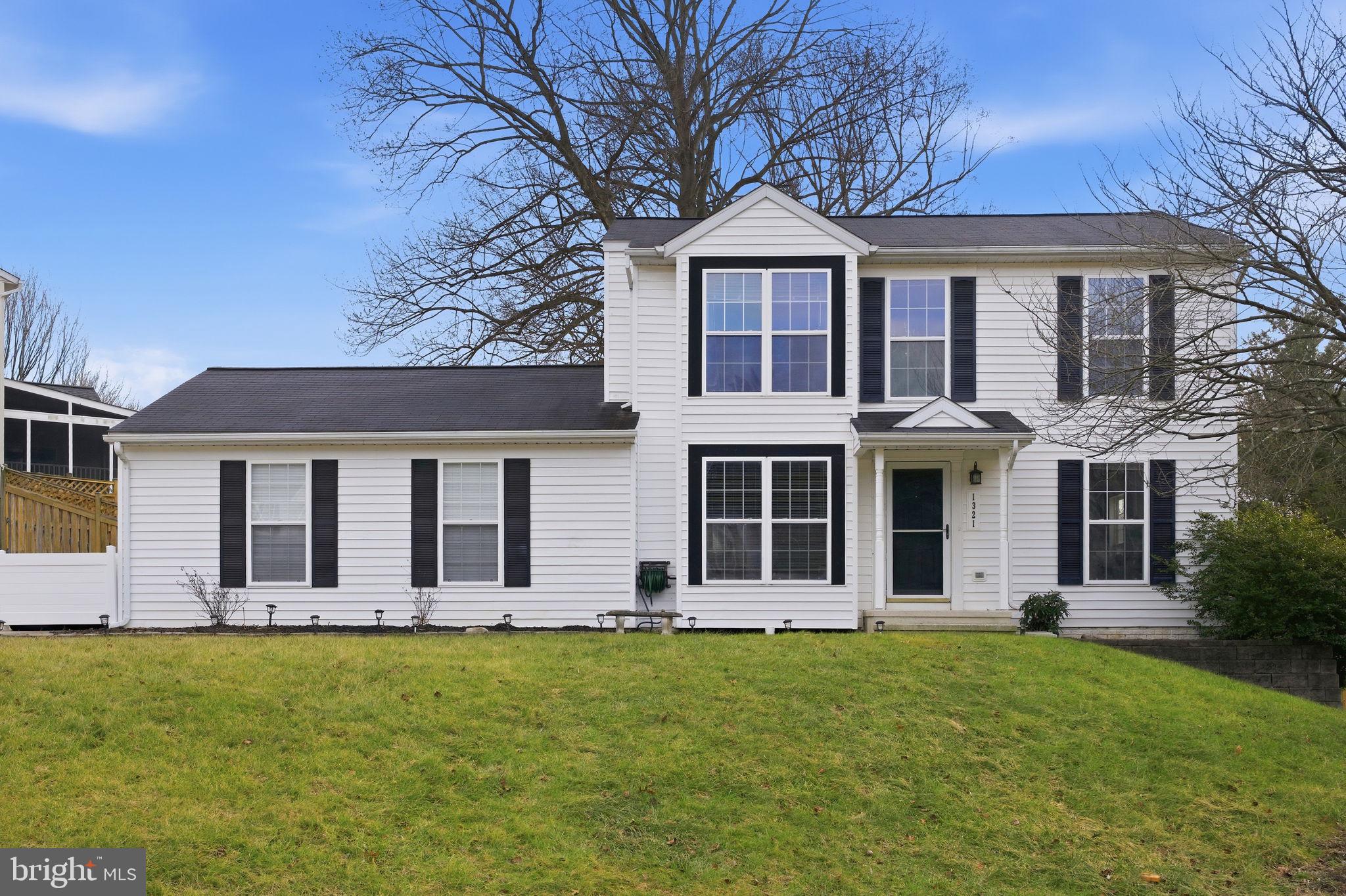 Beautifully maintained 4-bedroom, 2.5-bath home located in Eldersburg Estates, set on a quiet cul-de-sac in a peaceful neighborhood. The main level offers a comfortable and functional layout with a welcoming living room, dining room, kitchen, and powder room, all highlighted by hardwood floors. Off the kitchen, the family room features a wood-burning fireplace and sliding doors that open to a covered deck with views of open space. The upper level includes a spacious primary bedroom, two additional generously sized bedrooms, and a full hall bath. The finished lower level offers a recreation room, fourth bedroom, full bathroom, and a laundry area with additional storage. Side access leads to a fenced backyard featuring a paver brick patio, ideal for outdoor play and entertaining.. An oversized two-car side-entry garage and a double-wide driveway provide ample parking.