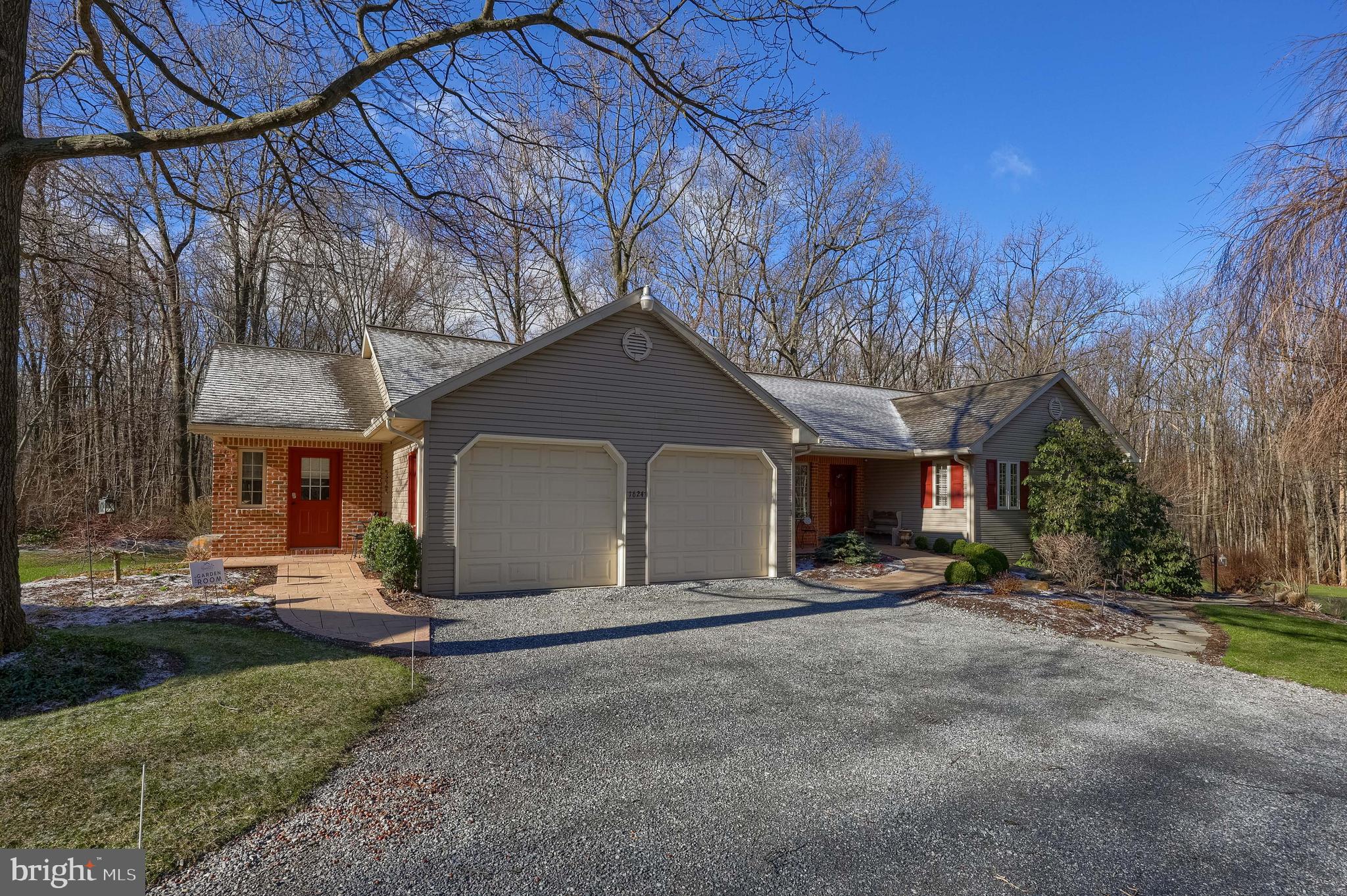 This property is going to onsite auction 7/9/2026 at 6:00 PM and is being sold with reserve. LISTED PRICE IS ONLY A SUGGESTED OPENING BID AND IS NOT INDICATIVE OF THE FINAL SALES PRICE WHICH WILL BE BY SELLER CONFIRMATION DAY OF AUCTION.  Terms: Down payment of $45,000 required day of auction. Settlement on or before August 26, 2026. Transfer taxes to be paid by buyer. Real Estate taxes shall be prorated.
Private 3-acre wooded retreat-like home features flexible multi-generational space, including a main-level in-law suite with its own kitchen and full bath, along with a fully finished lower level complete with an additional kitchen and bathroom—ideal for extended family, guests, or versatile living arrangements.
Outdoor living is a true highlight, featuring a beautiful stamped concrete patio with a custom brick fireplace, perfect for entertaining or relaxing year-round. The property also includes a
dedicated fire pit area, picnic space, and wooded surroundings, creating a peaceful, retreat-like atmosphere. A private play area adds even more usability to the outdoor space.
For those needing workspace or storage, the 24’ x 36’ detached garage offers two bays plus a workshop area, complete with water and electric—well-suited for hobbyists, contractors, or equipment storage.
Energy efficiency is enhanced by a seller-owned 12 KW solar system, providing long-term savings and sustainability.
A unique opportunity combining privacy, outdoor enjoyment, and flexible living options—all in one well-rounded property