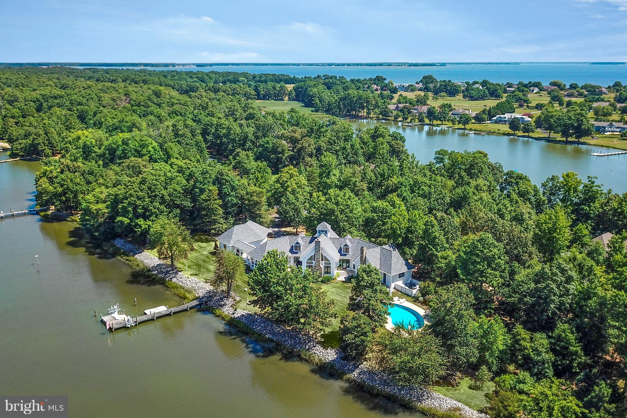 Waterfront living in Cove Creek Club. This spectacular home offers water views from every room, approx. 400' of water frontage, family room w/ cathedral ceiling & stone FP, updated gourmet kitchen, screened porch, luxurious master suite w/ FP, additional 3BR, 3.5BA, wonderful pool overlooking creek, dock w/ lift, & a new roof. Water 3ML. HOA incl. club house, golf course, marina, tennis & more!