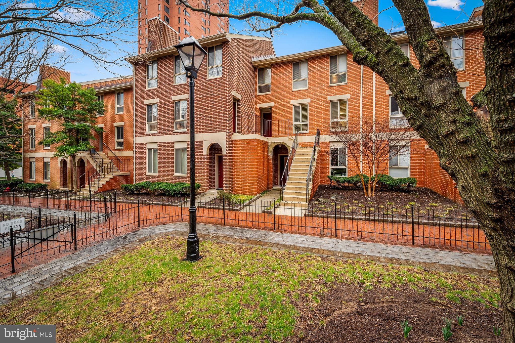 Two  bedroom, 2 bathroom condo in the perfect park-front Otterbein location – with secure parking! The condo features a wonderful and practical  floor plan, including a living area with fireplace, updated stainless steel appliances, an in-unit washer and dryer, and a neutral decor.  The owners added engineered hardwood flooring, plantation shutters throughout, and all new windows with sound attenuation.  The primary bedroom has an en-suite bathroom and two large closets. The second bedroom is similarly  sized and has a full bathroom in the hall.   There is easy parking with one spot in the gated parking lot just behind the building as well as a nice little park for dog walking. Situated on a quiet tree-lined pedestrian park (Andrew Place), this condo is a short walk to the Inner Harbor, MARC train, UMD, stadiums, Federal Hill, and all major highways. Low condo fee of $231/month.