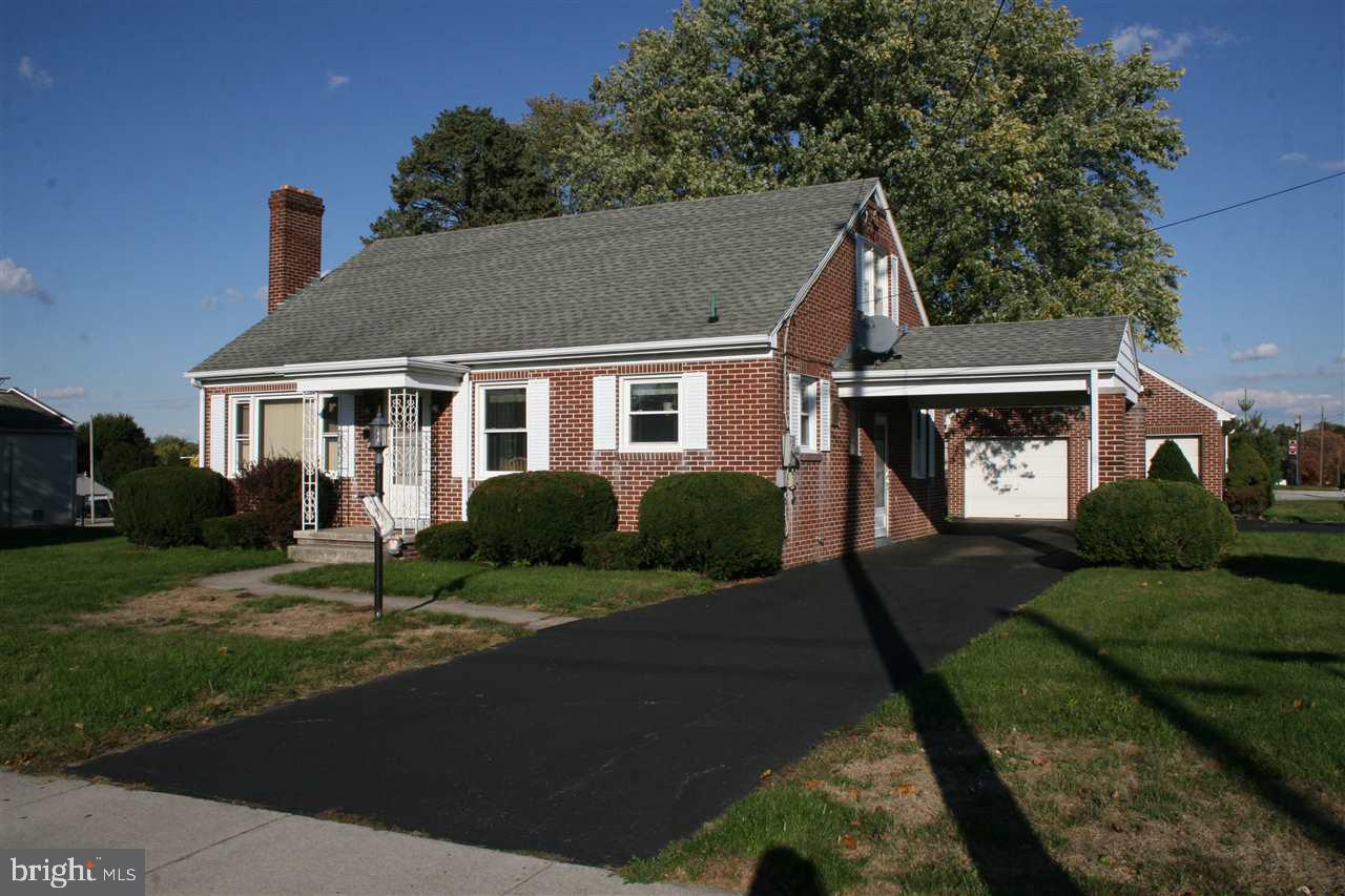 Sturdy brick home with newly finished 2nd floor with walk-in closet.  Hardwood & tile floors thru-out. Newer windows. Newer furnace. Central air. Updated plumbing and electric. Covered side porch.  Convenient carport and 2 car detached garage with storage above.  Convenient South Hanover location.