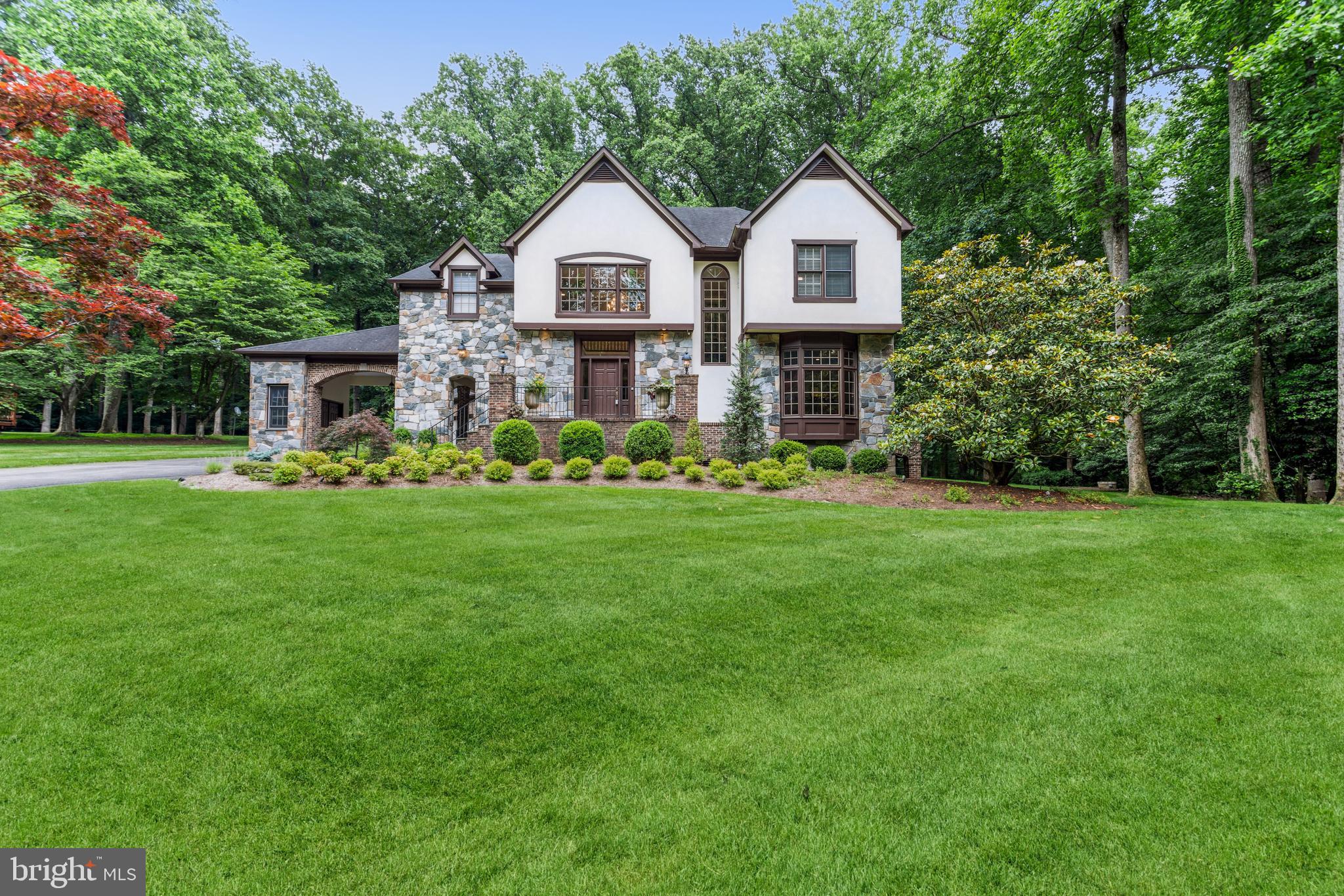 Welcome to 9715 Meadowmere Dr, Vienna, Va, located on a lush and inviting street with consistent, custom, estate homes.  Custom construction,  impeccably design with refined finishes on .89 acres at the end of a cul-de-sac backing to parkland, near Meadowlark Botanical Gardens, Wolf Trap National Park for The Performing Arts, Dulles Toll Road, 495, Tysons Corner, and multiple commuting options to DC or Amazon HQ2!  This spectacular French Country style home features 5 bedrooms plus a den on three finished levels boasting over 6800 finished square feet!  The home has 4 gas fireplaces and a generator.  

The main floor provides a brand-new marble foyer, updated kitchen with Thermador & Sub-Zero appliances, quartz counter tops, abundant storage, a breakfast room, spacious family room, screened in porch, formal living and dining rooms, a library, and two impeccably decorated half baths. The functional floor plan is ideal for everyday living and entertaining.  

The upper-level features four spacious bedrooms and three baths.  The primary bedroom has a private terrace overlooking the parkland behind the home, as well as two spacious custom closets, outfitted with refined fixtures and dressing area features.  The primary spa-like bathroom boasts a steam shower with granite counters, customer cabinetry, a jetted tub and a water closet. 

The finished, sunny, walk-up lower-level boasts a built-in wet bar with beverage center, ice maker and dishwasher with granite counters, a fireplace, billiards area, bedroom, full bath and den.  The lower level provides a spacious cedar closet, wine storage room, den that could be used as an office or 6th sleeping space, and a spacious storage room.  

Beautifully landscaped, with room for a pool, offering year-round beauty and nearby convenience to multiple shopping, dining, country club, and the W&OD trail system. The spacious lot provides plenty of room for a pool, fence and multiple outdoor living options.  Less than 3 miles from Westwood  Country Club, offering a premier golf, tennis, swimming and dining membership. 

Zoned for Fairfax County Public Schools, with multiple private school options nearby