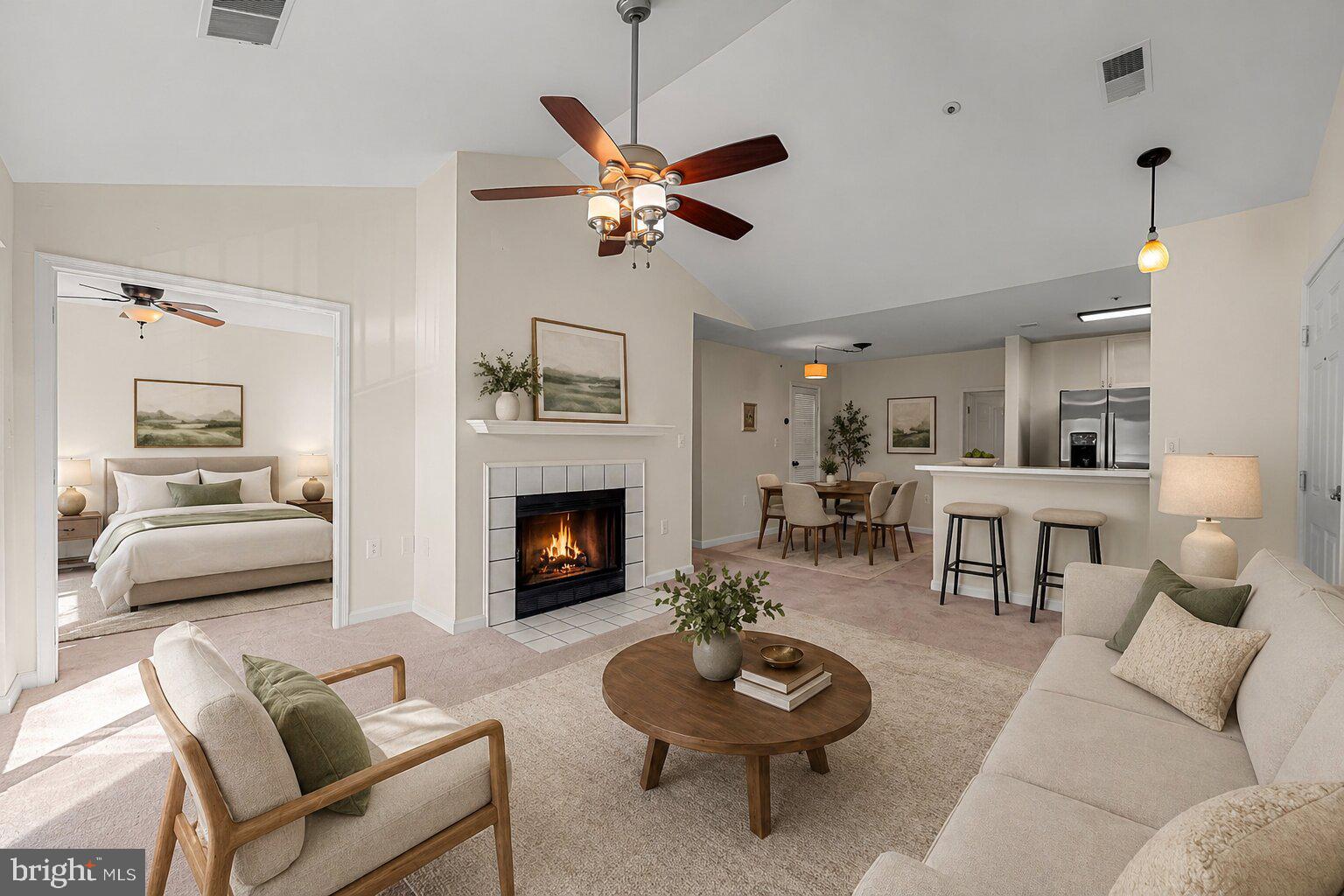 TOP-FLOOR UNIT WITH VAULTED CEILINGS & PRIVATE TREE VIEWS! FHA and VA Approved Financing - Spacious top floor 2-bedroom condo featuring fresh paint and brand-new carpet throughout, updated bath, and an open kitchen overlooking the living room, outdoors and wood-burning fireplace. Enjoy the tree view balcony with storage and the convenience of  Red Run Stream Valley Trail just steps away. Plenty of storage inside and out. You deserve maintenance-free living with community pool access! Main photo virtually staged.