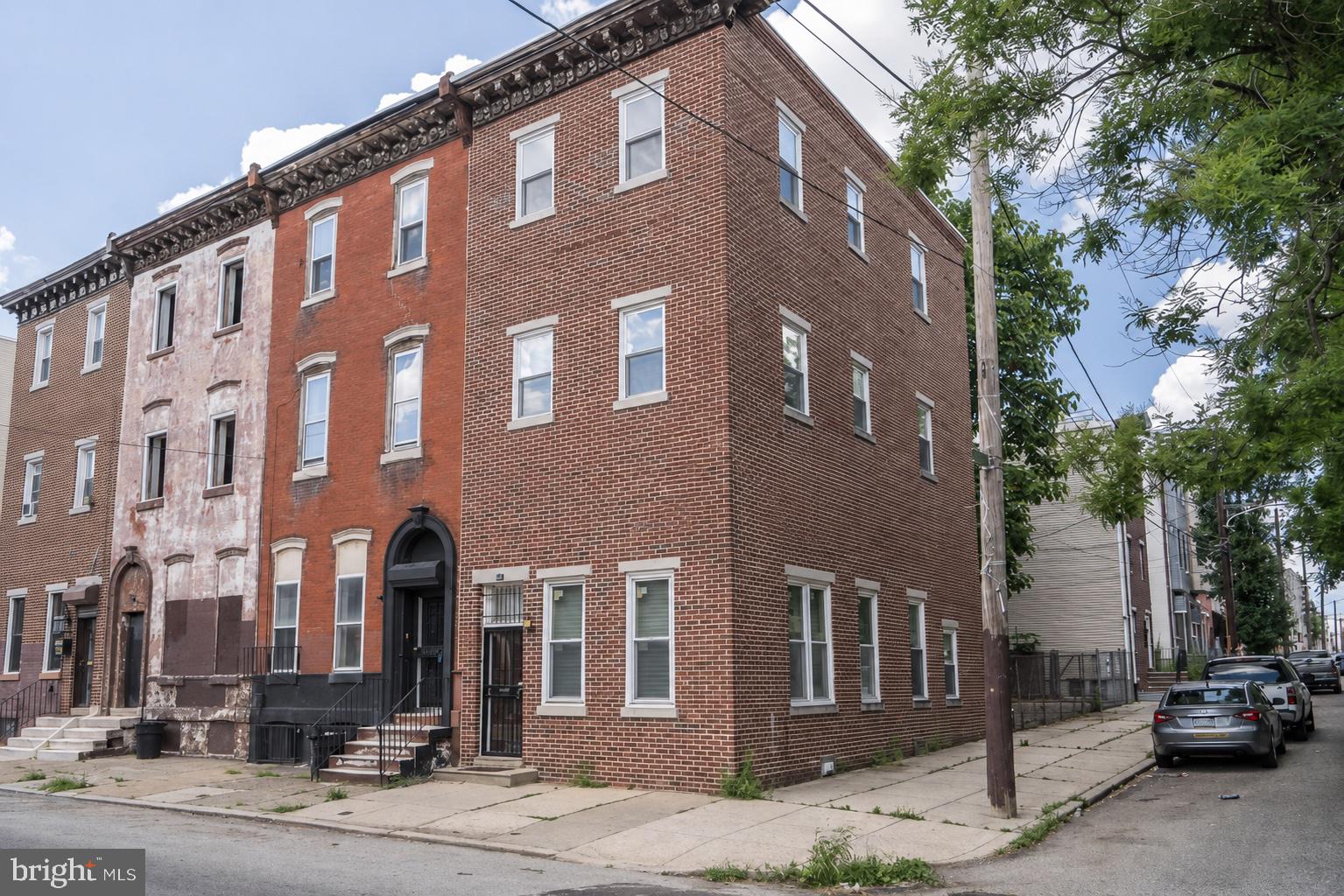 Investment opportunity! This beautiful home has 4 bedrooms, 2.5 baths and is in the heart of it all. Steps away from Temple University's campus and a stones throw from Center City and all the best that Philly has to offer.  1619 W Master St is currently rented for $1995/month through 7/31/27. This spotless home features sun-flooded rooms with huge windows and beautiful oak hardwood floors throughout. This corner unit has a huge rear flex area which can be private parking for 3+ cars or be used as a backyard for entertaining. Additionally, the full basement provides ample storage space and a washer/dryer for convenience. Being in close proximity to Broad St & Girard Ave provides easy access to subways, buses and trolleys. This property is perfect to add to your portfolio. May also be purchased along with other properties in the area in a package deal. Please inquire for details. Schedule your appointment today!