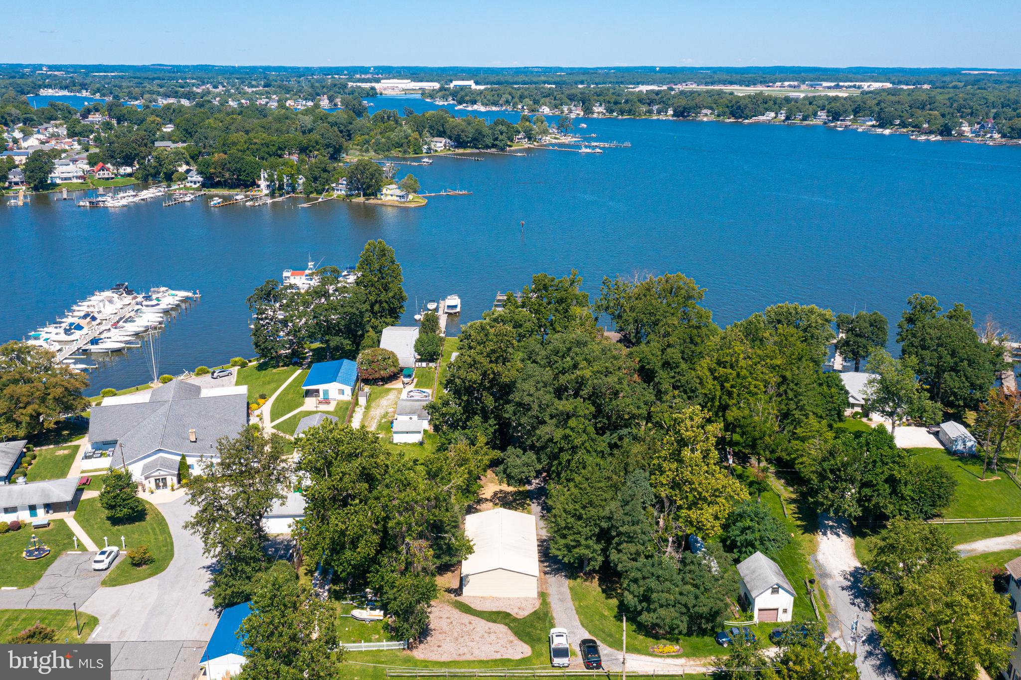 Extremely Rare Opportunity! 110' +/- Water frontage sitting on Over 1 Acre of Property with Multiple Slips, DEEP Water & Great Elevation! Owner financing available and seller open to creative terms—bring your vision and make this extraordinary waterfront property yours!