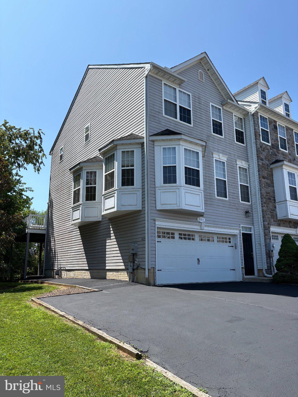 Three Story huge luxury end unit townhouse with a TWO car garage.  Home sits on the best lot in the community with privacy and long range views.  Economical Natural Gas heat, southern exposure, AND NO CITY Taxes.  2 minutes from I -70 for easy commutes.  Shopping minutes away.  Huge home fully finished on all levels.  3 Story Bump Out.  3 .5 baths.  Luxury Owners bath with sitting room. Huge private deck.