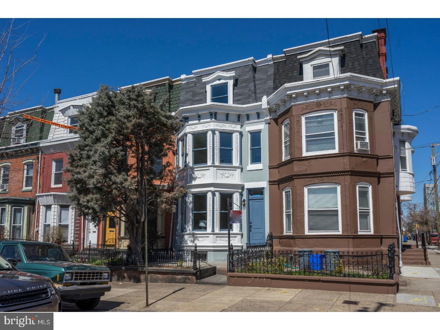 Welcome to 2203 Bainbridge Street,  a complete renovation of this beautiful Graduate Hospital neighborhood rowhome from the late 1800's located within the Greenfield School Catchment. The home boasts approximately 1800 square feet of living space with 3 bedrooms, 2.5 baths, and a clean unfinished basement. Amazing curb appeal with a brick and ornate pressed tin front facade along with front garden surrounded by a beautiful wrought iron fence. Modernized with all new mechanical  systems and smart home technology, including wifi-enabled LED recessed lighting and NEST thermostats. First floor features an open floor plan with convenient powder room, and an abundance of windows for natural light. The large modern kitchen is equipped with Bosch & Frigidaire appliances as well as built in wine fridge, beautiful granite counter-tops, and exquisite tiled backsplash. The second floor consists of 2 full bedrooms with ample closet space, large full bath with 6' Kohler soaking tub and double sink vanity, hall linen closet, laundry room with full size gas dryer and wifi-enabled washing machine. On the third floor you'll find the master bedroom, spacious bathroom with double sink vanity, walk-in shower and a hall linen closet. 10 YEAR TAX ABATEMENT APPROVED. Schedule your visit today!