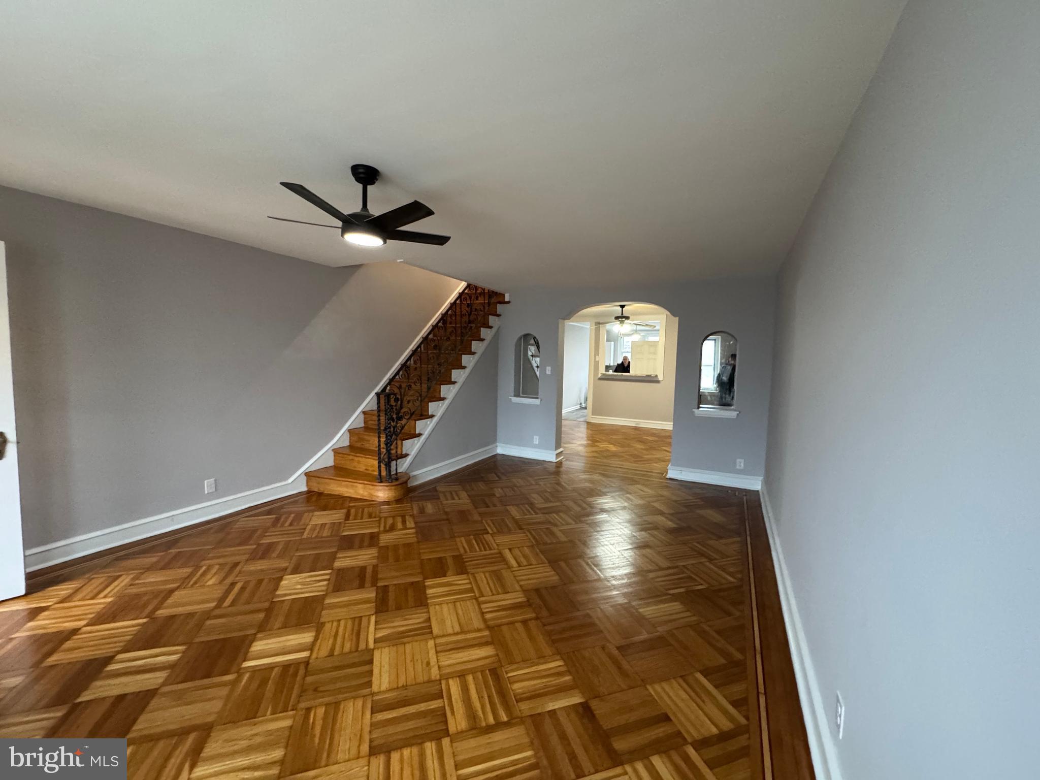 COMING SOON -3/30/25  SHOWINGS START AT OPEN HOUSE  FROM 12 PM to 2 PM. Don't miss this large 1404 Sf  West Mayfair Chippendale Model stone castle front straight- through. Enter through a air lock foyer door to a beautiful living room with refinished parquet inlaid crafted floors to a generous sized dining room  with an open pass through  bar  counter to a large remodeled eat in kitchen featuring a brand new stove and microwave and a high end  Boesch dishwasher accented by a lovely granite countertops.  The first floor is AC is furnished by a large unit in the dining room and 3 ceiling fans.  Climb the refinished stairs with a decor wrought iron railing to 3 generous sized bedrooms, also with beautiful refinished parquet inlaid floors. The three piece hall bath features a seperate stall shower and full tub and a antique stain glass opening skylight. Enjoy the finished family room with luxury durable vinyl  floors, a full bath, utility room with extra storage, laundry room and a ground level exit to the rear driveway and  garage.  The entire home has recently been repainted . H2O tank replaced 11/20/23 Furnace replace 12/21/16. Roof coated 2024. Replacement windows where shown.